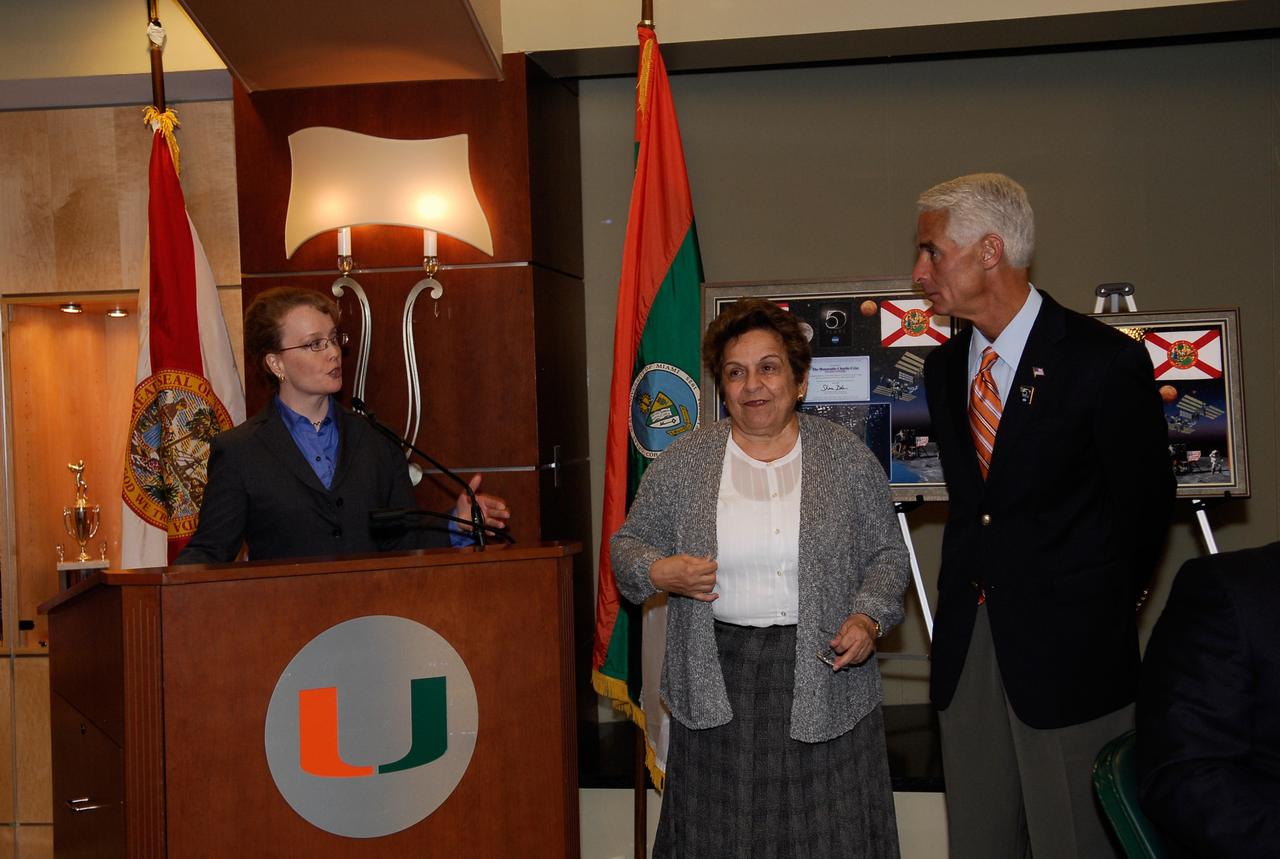 CAPE CANAVERAL, Fla. --  At the luncheon held during NASA’s Future Forum in Miami, NASA’s Deputy Administrator Shana Dale presents Florida Gov. Charlie Crist (on the right).  At center is Donna E. Shalala, president of the University of Miami.  The forum focused on how space exploration benefits Florida's economy. The event, which included presentations and panels, was held at the University of Miami's BankUnited Center.  Among those participating were NASA Deputy Administrator Shana Dale, astronaut Carl Walz, director of the Advanced Capabilities Division in NASA's Exploration Systems Mission Directorate, and Russell Romanella, director, International Space Station and Spacecraft Processing.   Photo credit: NASA/Kim Shiflett