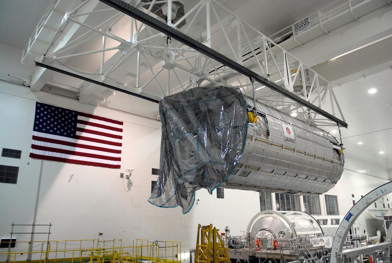 CAPE CANAVERAL, Fla. -- In the Space Station Processing Facility at NASA’s Kennedy Space Center, an overhead crane moves the Kibo Japanese Experiment Module - Pressurized Module across the floor toward a payload canister.  The canister will deliver the module, part of the payload for space shuttle Discovery’s STS-124 mission, to Launch Pad 39A.  On the mission, the STS-124 crew will transport the Kibo module as well as the Japanese Remote Manipulator System to the International Space Station to complete the Kibo laboratory.  The launch of Discovery is targeted for May 31.   Photo credit: NASA/Kim Shiflett