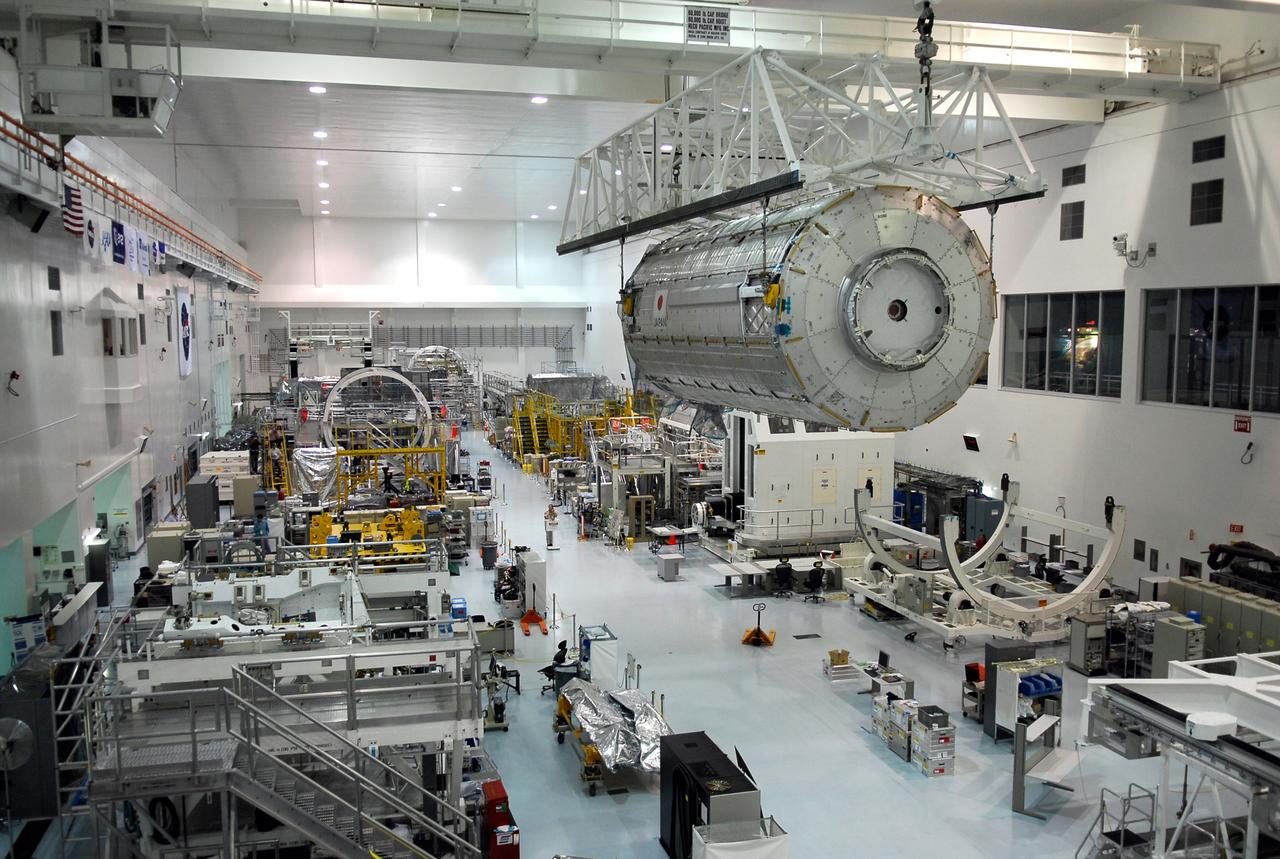 CAPE CANAVERAL, Fla. -- In the Space Station Processing Facility at NASA’s Kennedy Space Center, an overhead crane moves the Kibo Japanese Experiment Module - Pressurized Module across the floor toward a payload canister. The canister will deliver the module, part of the payload for space shuttle Discovery’s STS-124 mission, to Launch Pad 39A. On the mission, the STS-124 crew will transport the Kibo module as well as the Japanese Remote Manipulator System to the International Space Station to complete the Kibo laboratory. The launch of Discovery is targeted for May 31. Photo credit: NASA/Kim Shiflett