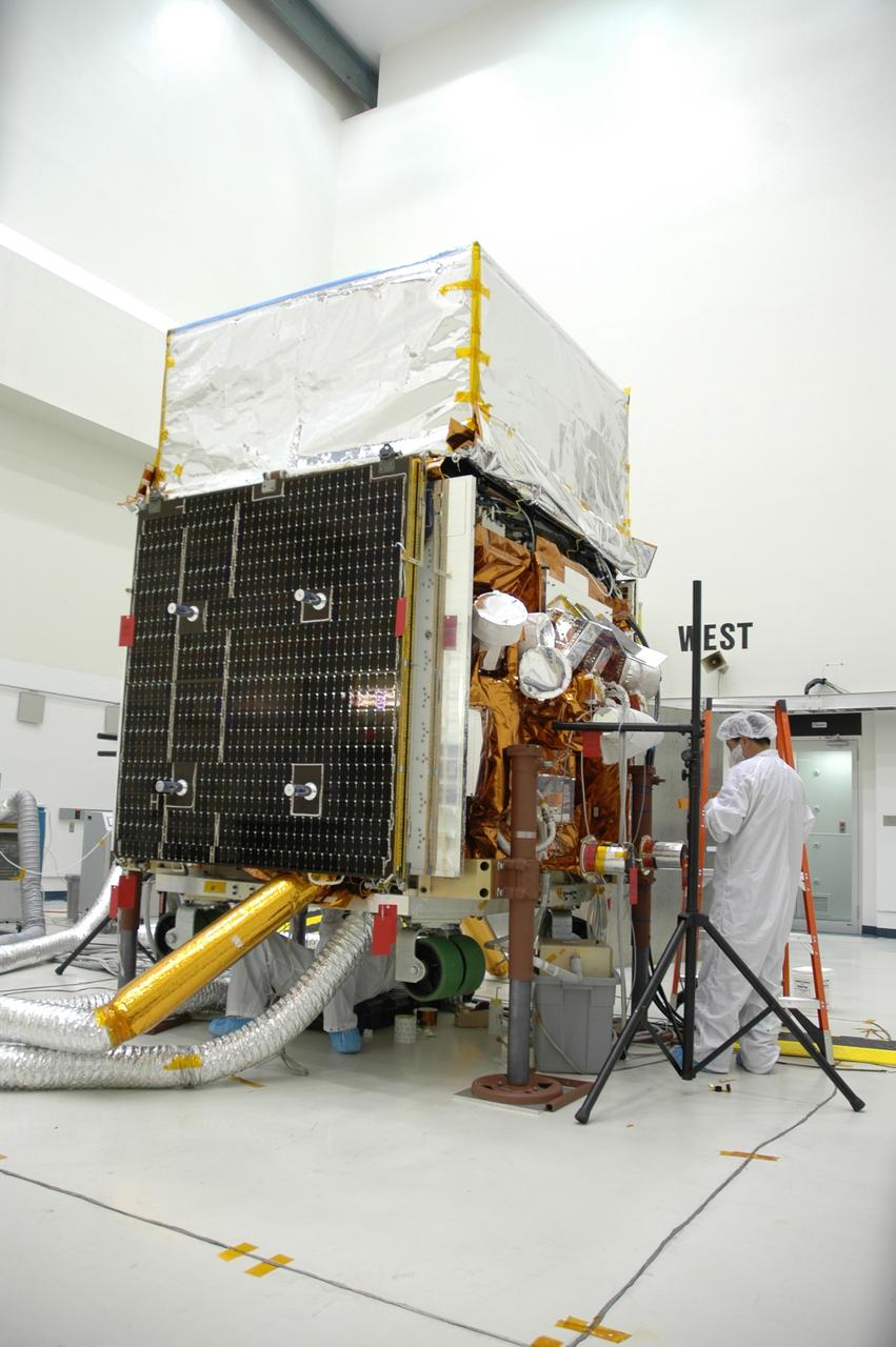 CAPE CANAVERAL, Fla. -- At the Astrotech payload processing facility in Titusville, Fla., workers prepare NASA's Gamma-ray Large Area Space Telescope, or GLAST, spacecraft for star tracker sun shade installation. The GLAST is a powerful space observatory that will explore the Universe's ultimate frontier, where nature harnesses forces and energies far beyond anything possible on Earth; probe some of science's deepest questions, such as what our Universe is made of, and search for new laws of physics; explain how black holes accelerate jets of material to nearly light speed; and help crack the mystery of stupendously powerful explosions known as gamma-ray bursts. A launch date is still to be determined. Photo credit: NASA/Cory Huston