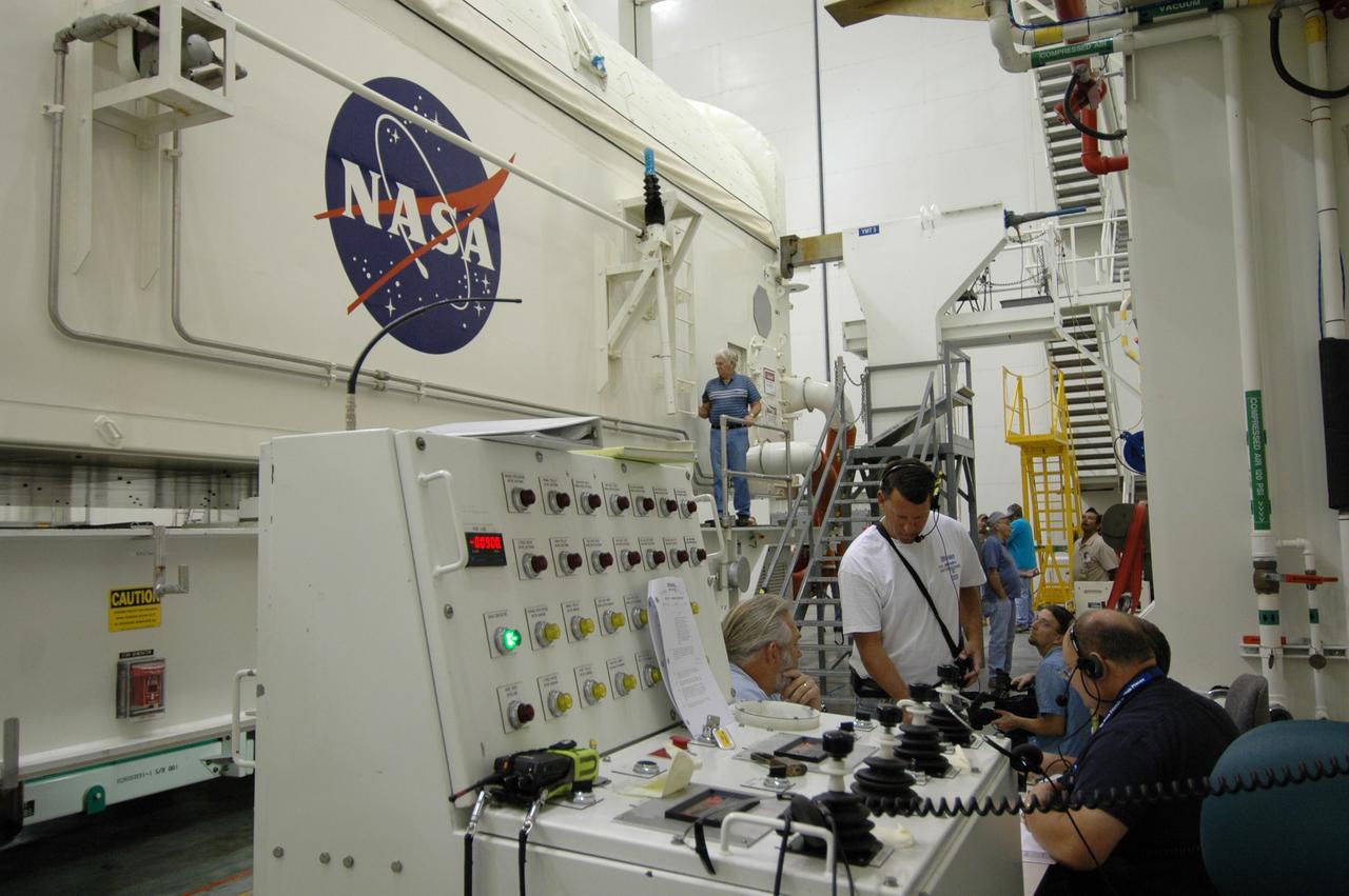 CAPE CANAVERAL, Fla. --  In the Vertical Integration Facility at NASA's Kennedy Space Center, technicians monitor the rotation of the payload canister to a vertical position. The canister contains the Japanese Experiment Module -Pressurized Module.  The canister will be transported to Launch Pad 39A for space shuttle Discovery’s STS-124 mission.  At the pad, the payload will be transferred from the canister into the payload changeout room on the rotating service structure.  The changeout room is the enclosed, environmentally controlled portion of the service structure that supports cargo delivery to the pad and subsequent vertical installation into an orbiter's payload bay. On the mission, the STS-124 crew will transport the JEM as well as the Japanese Remote Manipulator System to the International Space Station.  The launch of Discovery is targeted for May 31.    Photo credit: NASA/Jim Grossmann