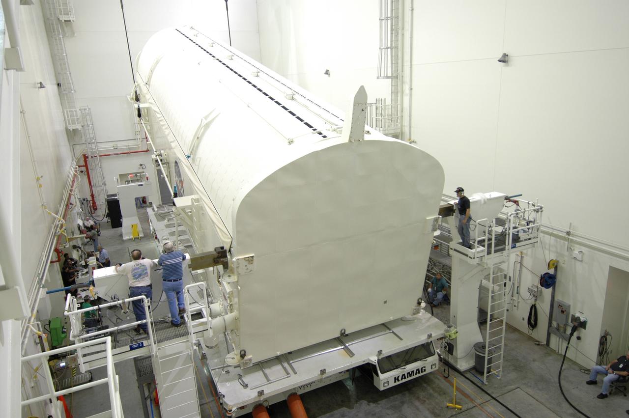 CAPE CANAVERAL, Fla. -- In the Vertical Integration Facility at NASA's Kennedy Space Center, movement begins to raise the payload canister containing the Japanese Experiment Module -Pressurized Module to a vertical position.  The canister will be transported to Launch Pad 39A for space shuttle Discovery’s STS-124 mission.  At the pad, the payload will be transferred from the canister into the payload changeout room on the rotating service structure.  The changeout room is the enclosed, environmentally controlled portion of the service structure that supports cargo delivery to the pad and subsequent vertical installation into an orbiter's payload bay. On the mission, the STS-124 crew will transport the JEM as well as the Japanese Remote Manipulator System to the International Space Station.  The launch of Discovery is targeted for May 31.    Photo credit: NASA/Jim Grossmann