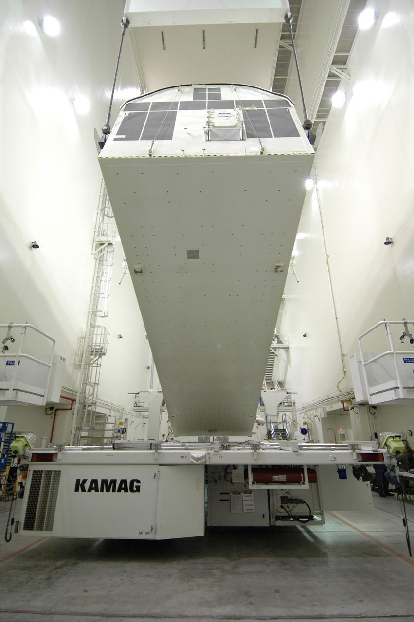 CAPE CANAVERAL, Fla. -- In the Vertical Integration Facility at NASA's Kennedy Space Center, the payload canister containing the Japanese Experiment Module -Pressurized Module is being raised to a vertical position. The canister contains the Japanese Experiment Module -Pressurized Module, which will be transported to Launch Pad 39A for space shuttle Discovery’s STS-124 mission.  At the pad, the payload will be transferred from the canister into the payload changeout room on the rotating service structure.  The changeout room is the enclosed, environmentally controlled portion of the service structure that supports cargo delivery to the pad and subsequent vertical installation into an orbiter's payload bay. On the mission, the STS-124 crew will transport the JEM as well as the Japanese Remote Manipulator System to the International Space Station.  The launch of Discovery is targeted for May 31.    Photo credit: NASA/Jim Grossmann