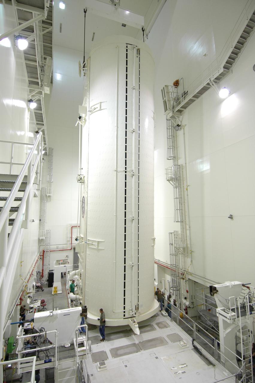CAPE CANAVERAL, Fla. -- After rotation in the Vertical Integration Facility at NASA's Kennedy Space Center, the payload canister is lowered vertically onto the payload canister transporter.  The canister contains the Japanese Experiment Module -Pressurized Module, which will be transported to Launch Pad 39A for space shuttle Discovery’s STS-124 mission.  At the pad, the payload will be transferred from the canister into the payload changeout room on the rotating service structure.  The changeout room is the enclosed, environmentally controlled portion of the service structure that supports cargo delivery to the pad and subsequent vertical installation into an orbiter's payload bay. On the mission, the STS-124 crew will transport the JEM as well as the Japanese Remote Manipulator System to the International Space Station.  The launch of Discovery is targeted for May 31.    Photo credit: NASA/Jim Grossmann