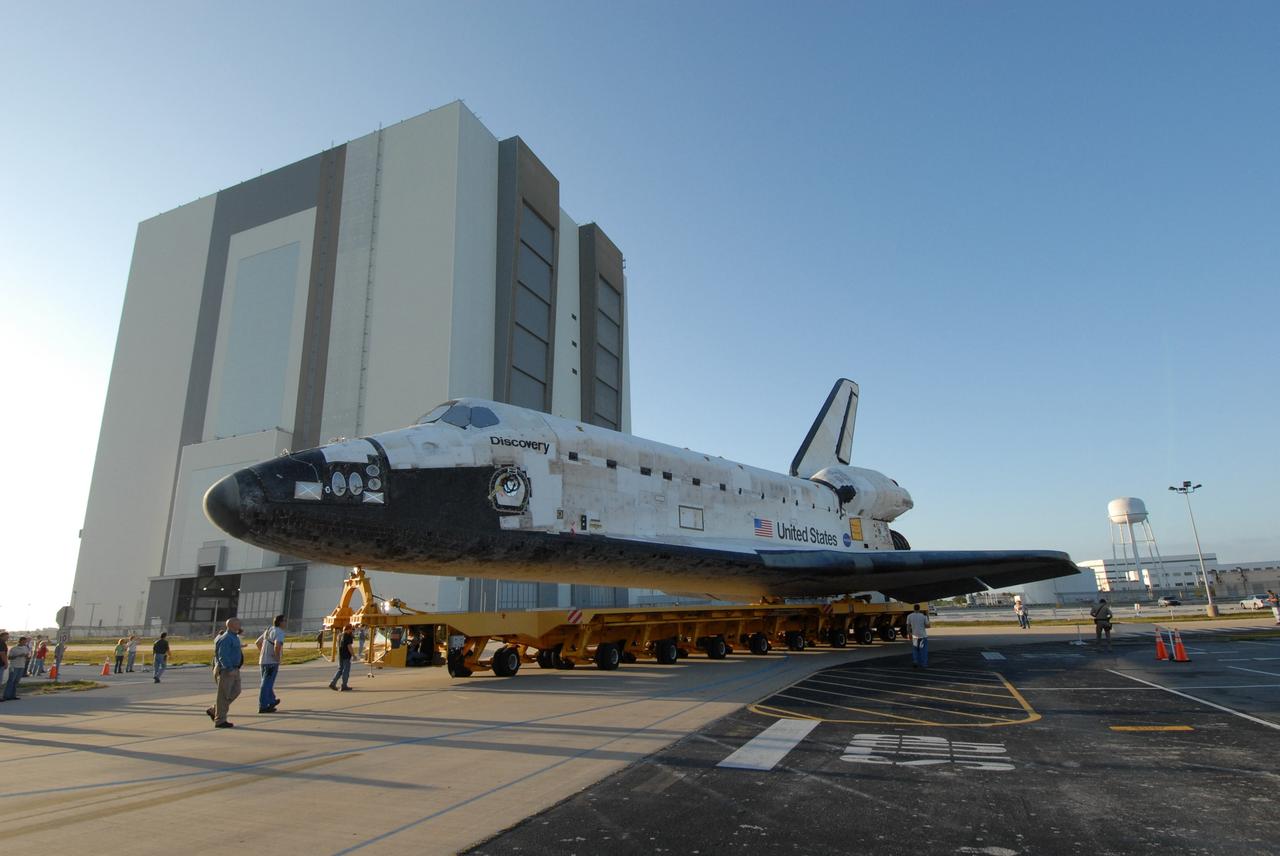 CAPE CANAVERAL, Fla. --  Towed on its 76-wheeled orbiter transporter, space shuttle Discovery begins its turn away from the Orbiter Processing Facility to roll over to the Vehicle Assembly Building, or VAB, at NASA's Kennedy Space Center. In high bay 3 of the VAB, Discovery will be attached to its external fuel tank and solid rocket boosters in preparation for its upcoming STS-124 mission to the International Space Station.  On the mission, the STS-124 crew will transport the Japanese Experiment Module - Pressurized Module and the Japanese Remote Manipulator System to the space station.  Launch of Discovery is targeted for May 31. Photo credit: NASA/Troy Cryder