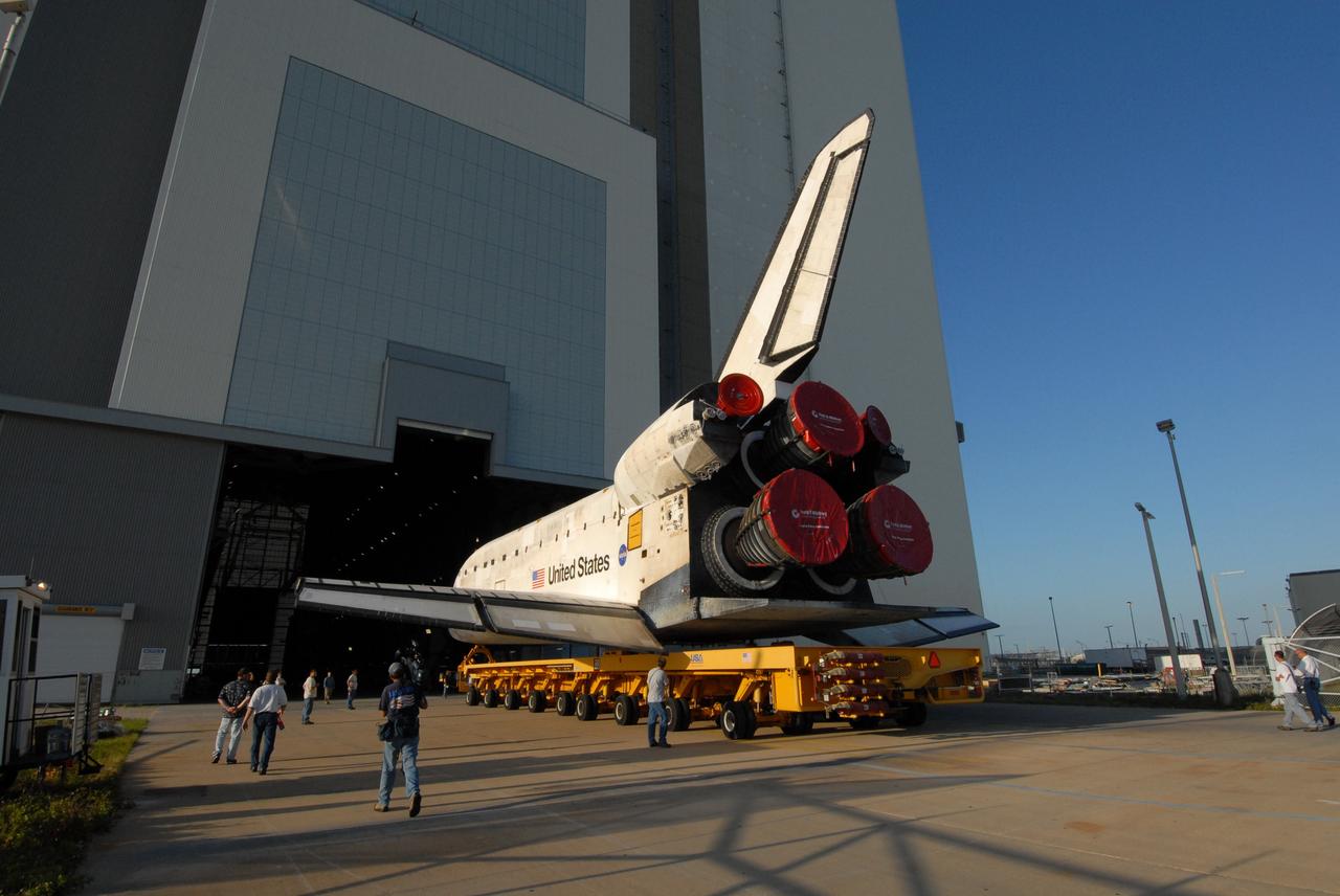 CAPE CANAVERAL, Fla. --  Space shuttle Discovery rolls toward the open doors of the Vehicle Assembly Building, or VAB, at NASA's Kennedy Space Center. It rests on the orbiter transporter system, which has 76 wheels and measures 106.5 feet long.  Inside the VAB, Discovery will be attached to its external fuel tank and solid rocket boosters in high bay 3 in preparation for its upcoming STS-124 mission to the International Space Station. On the mission, the STS-124 crew will transport the Japanese Experiment Module - Pressurized Module and the Japanese Remote Manipulator System to the space station.  Launch of Discovery is targeted for May 31. Photo credit: NASA/Troy Cryder