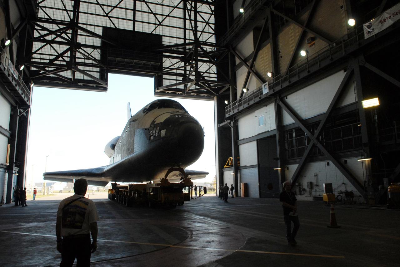 CAPE CANAVERAL, Fla. --  Towed on its 76-wheeled orbiter transporter, space shuttle Discovery rolls into the transfer aisle of the Vehicle Assembly Building at NASA's Kennedy Space Center.  Discovery will be raised to vertical and lifted into high bay 3 for attachment to its external fuel tank and solid rocket boosters in preparation for its upcoming STS-124 mission to the International Space Station.  On the mission, the STS-124 crew will transport the Japanese Experiment Module - Pressurized Module and the Japanese Remote Manipulator System to the space station.  Launch of Discovery is targeted for May 31. Photo credit: NASA/Troy Cryder