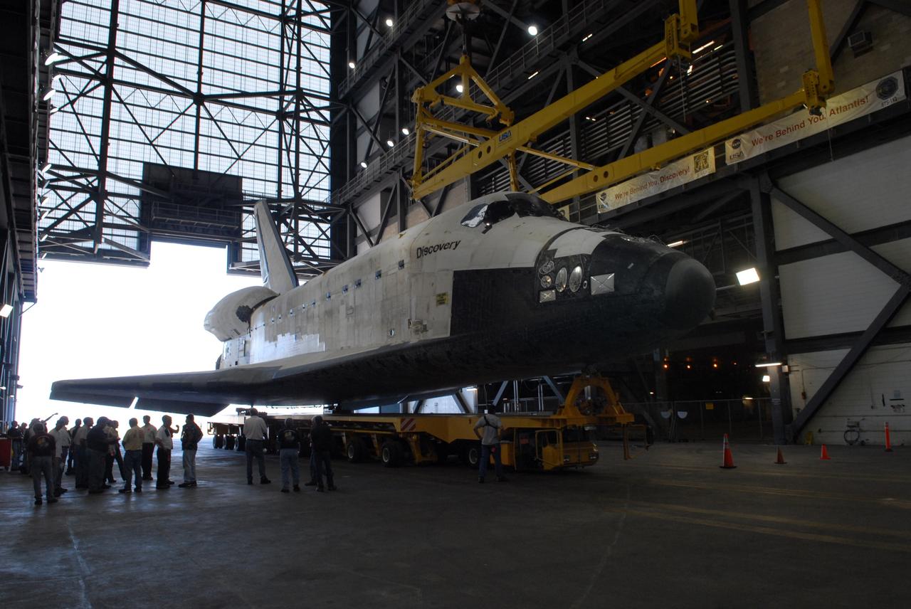 CAPE CANAVERAL, Fla. --  Towed on its 76-wheeled orbiter transporter, space shuttle Discovery rolls into the transfer aisle of the Vehicle Assembly Building at NASA's Kennedy Space Center.  Discovery will be raised to vertical and lifted into high bay 3 for attachment to its external fuel tank and solid rocket boosters in preparation for its upcoming STS-124 mission to the International Space Station.  On the mission, the STS-124 crew will transport the Japanese Experiment Module - Pressurized Module and the Japanese Remote Manipulator System to the space station.  Launch of Discovery is targeted for May 31. Photo credit: NASA/Troy Cryder