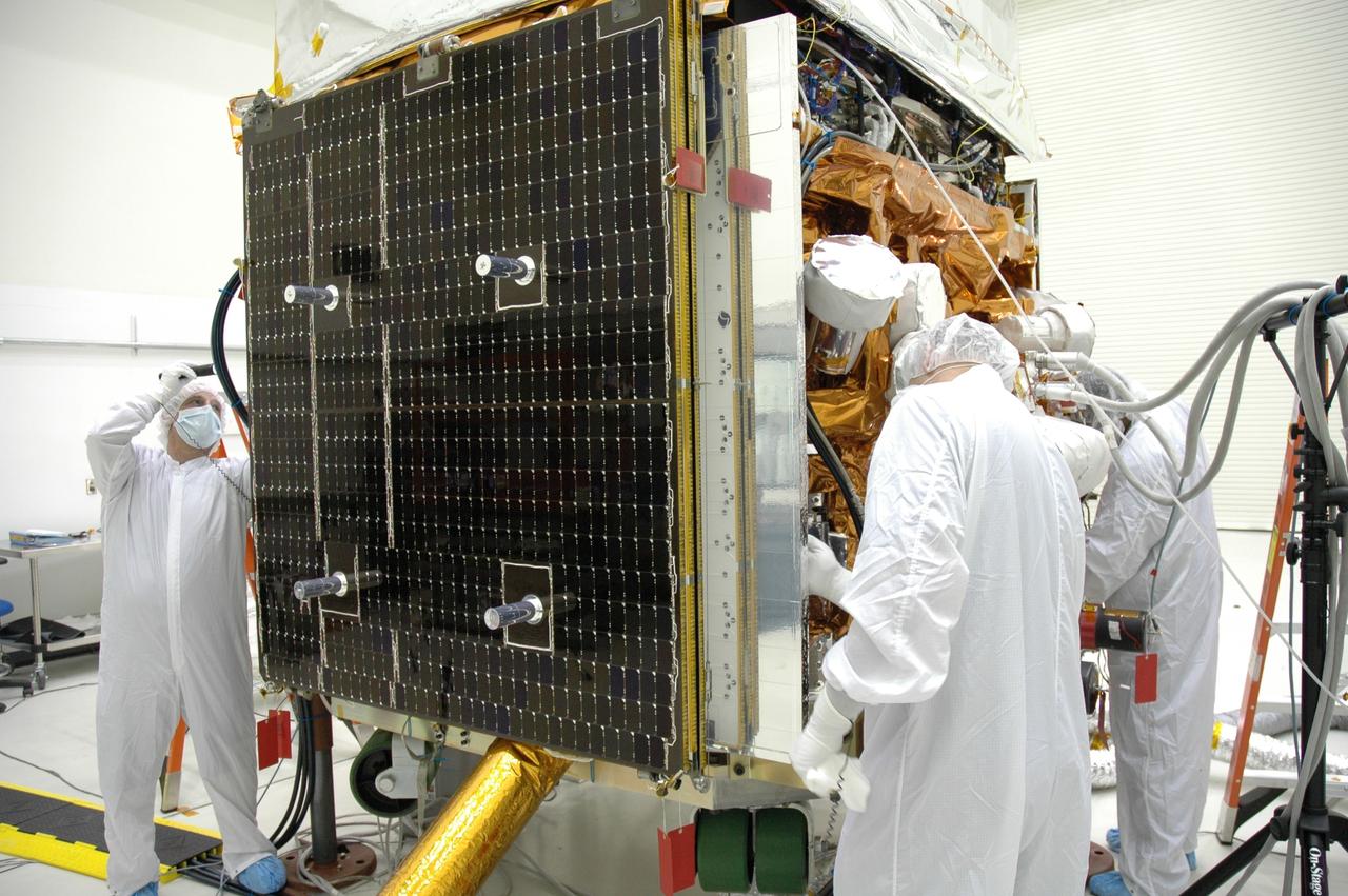 CAPE CANAVERAL, Fla. –   At the Astrotech payload processing facility, technicians give NASA's Gamma-ray Large Area Space Telescope, or GLAST,  spacecraft a final cleaning.  The GLAST is a powerful space observatory that will explore the Universe's ultimate frontier, where nature harnesses forces and energies far beyond anything possible on Earth;  probe some of science's deepest questions, such as what our Universe is made of, and search for new laws of physics; explain how black holes accelerate jets of material to nearly light speed; and help crack the mystery of stupendously powerful explosions known as gamma-ray bursts. A launch date is still to be determined.   Photo credit: NASA/Jim Grossmann