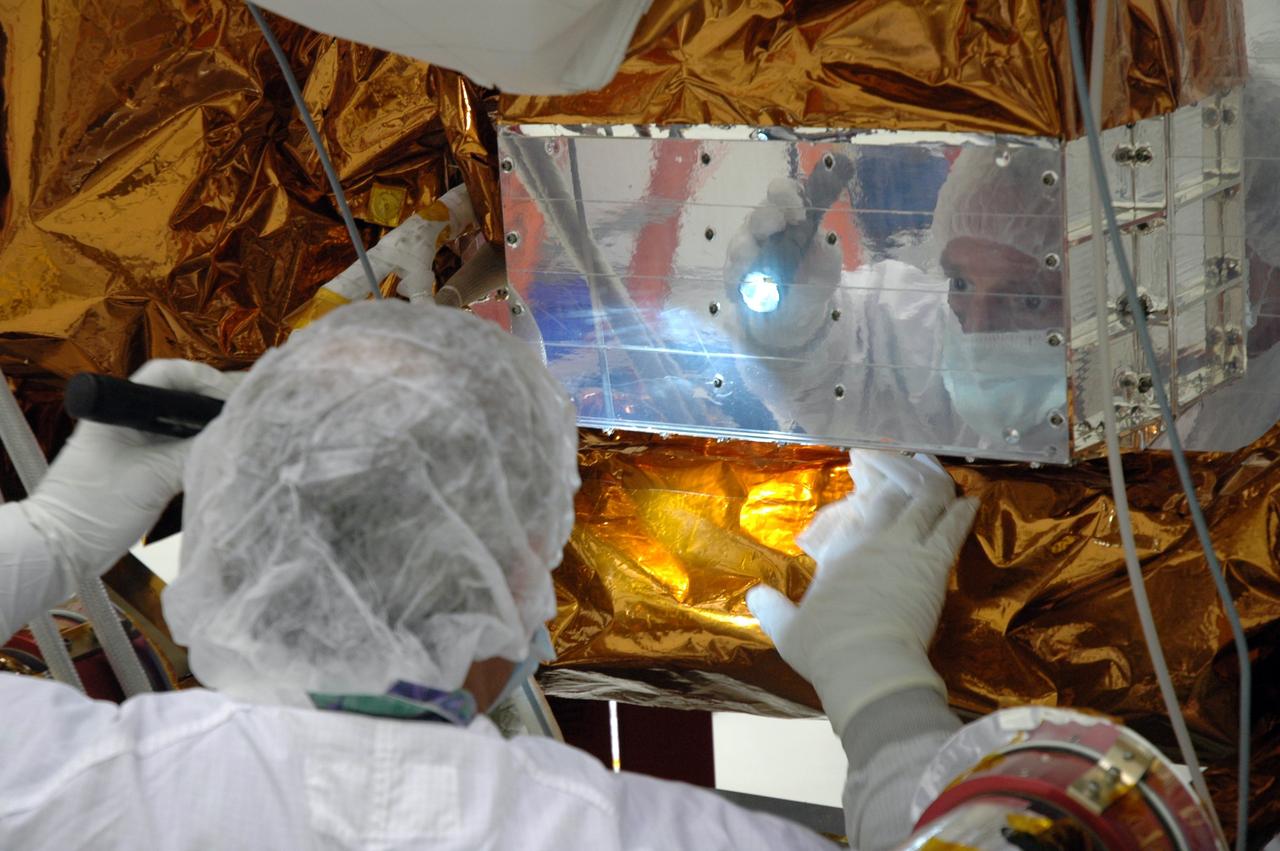 CAPE CANAVERAL, Fla. –    At the Astrotech payload processing facility, technicians give NASA's Gamma-ray Large Area Space Telescope, or GLAST,  spacecraft a final cleaning. The GLAST is a powerful space observatory that will explore the Universe's ultimate frontier, where nature harnesses forces and energies far beyond anything possible on Earth;  probe some of science's deepest questions, such as what our Universe is made of, and search for new laws of physics; explain how black holes accelerate jets of material to nearly light speed; and help crack the mystery of stupendously powerful explosions known as gamma-ray bursts. A launch date is still to be determined.   Photo credit: NASA/Jim Grossmann