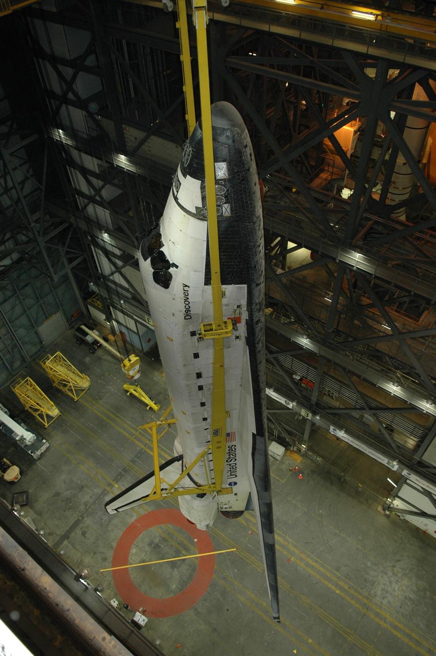 CAPE CANAVERAL, Fla. -- In the Vehicle Assembly Building at NASA's Kennedy Space Center, a crane lifts space shuttle Discovery into the upper levels. Discovery will be lowered into high bay 3 and mated to the external tank and solid rocket boosters waiting there in preparation for launch on the upcoming STS-124 mission to the International Space Station. On the mission, the STS-124 crew will transport the Japanese Experiment Module - Pressurized Module and the Japanese Remote Manipulator System to the space station. Launch of Discovery is targeted for May 31 Photo credit: NASA/Jim Grossmann