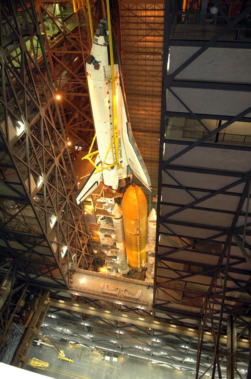 CAPE CANAVERAL, Fla. -- High above the transfer aisle of the Vehicle Assembly Building at NASA's Kennedy Space Center, space shuttle Discovery is moved into high bay 3. Below wait the solid rocket boosters and external tank for mating to the shuttle. The stacking of the four elements precedes their launch on the upcoming STS-124 mission to the International Space Station. On the mission, the STS-124 crew will transport the Japanese Experiment Module - Pressurized Module and the Japanese Remote Manipulator System to the space station. Launch of Discovery is targeted for May 31 Photo credit: NASA/Jim Grossmann