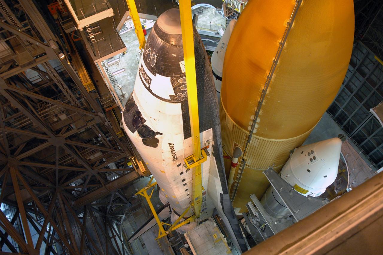 CAPE CANAVERAL, Fla. – In high bay 3 of the Vehicle Assembly Building at NASA's Kennedy Space Center, space shuttle Discovery continues to be lowered onto the mobile launcher platform in front of the solid rocket boosters and external tank. The stacking is in preparation for the launch on the upcoming STS-124 mission to the International Space Station. On the mission, the STS-124 crew will transport the Japanese Experiment Module - Pressurized Module and the Japanese Remote Manipulator System to the space station. Launch of Discovery is targeted for May 31 Photo credit: NASA/Jim Grossmann