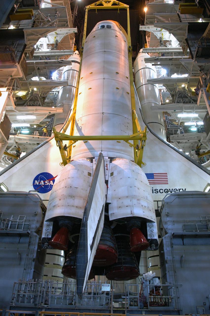 CAPE CANAVERAL, Fla. – In high bay 3 of the Vehicle Assembly Building at NASA's Kennedy Space Center, space shuttle Discovery continues to be lowered onto the mobile launcher platform in front of the solid rocket boosters and external tank. The stacking is in preparation for the launch on the upcoming STS-124 mission to the International Space Station. On the mission, the STS-124 crew will transport the Japanese Experiment Module - Pressurized Module and the Japanese Remote Manipulator System to the space station. Launch of Discovery is targeted for May 31 Photo credit: NASA/Jim Grossmann