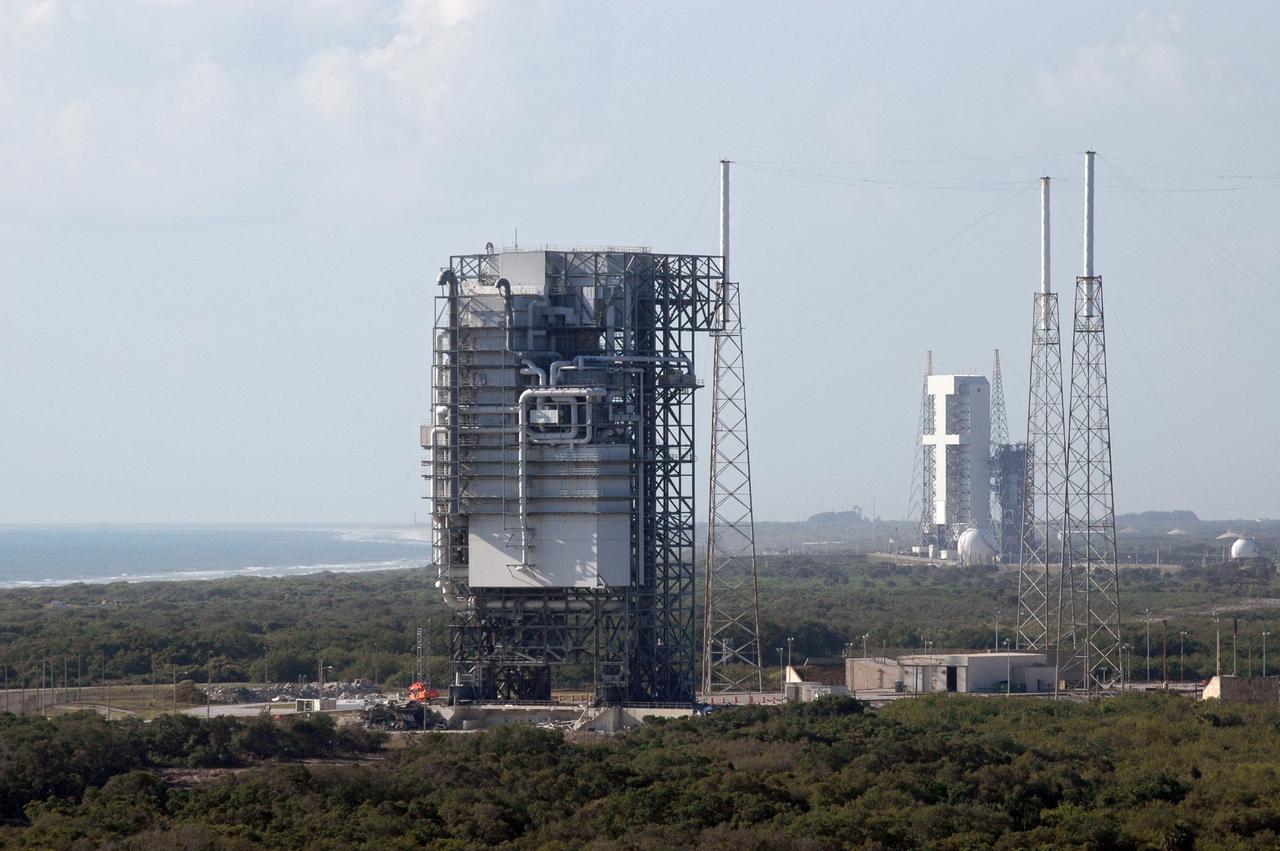 CAPE CANAVERAL, Fla. – The mobile service tower, or gantry, in the foreground at Space Launch Complex 40 on Cape Canaveral Air Force Station, is scheduled for demolition. The tall lightning towers around it will remain. This mammoth structure, with its cavernous clean room, was used for the final spacecraft launch preparations for NASA’s Cassini spacecraft, currently orbiting Saturn. The launch occurred on Oct. 15, 1997, aboard an Air Force Titan IV-Centaur rocket. The facilities at the pad are being dismantled to make room for the construction of launch pad access and servicing facilities for the new Falcon rockets to be launched by Space Exploration Technologies, known as SpaceX. Photo credit: NASA/Cory Huston