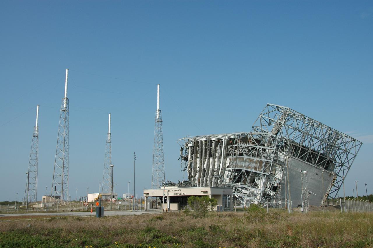 CAPE CANAVERAL, Fla. – Twisted metal is all that’s left of the mobile service tower, or gantry, at Space Launch Complex 40 on Cape Canaveral Air Force Station after its demolition April 27. This mammoth structure, with its cavernous clean room, was imploded to make room for the construction of launch pad access and servicing facilities for the new Falcon rockets to be launched by Space Exploration Technologies, known as SpaceX.  The gantry was used for the final spacecraft launch preparations for NASA’s Cassini spacecraft, currently orbiting Saturn.  The launch occurred on Oct. 15, 1997, aboard an Air Force Titan IV-Centaur rocket.  Photo credit: NASA/Jim Grossmann