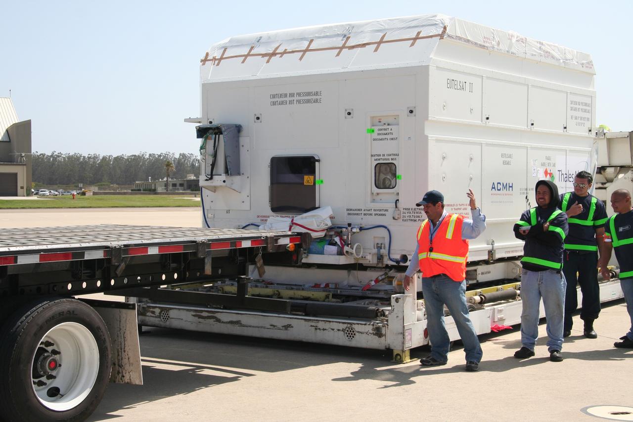 VANDENBERG AIR FORCE BASE, Calif.  –   Workers prepare to move the shipping container holding the OSTM/Jason-2 satellite onto a flatbed truck at Vandenberg Air Force Base.  The satellite will be transported to the Astrotech processing facility. The OSTM, or Ocean Topography Mission, on the Jason-2 satellite is a follow-on to Jason-1. It will take oceanographic studies of sea surface height into an operational mode for continued climate forecasting research and science and industrial applications.  This satellite altimetry data will help determine ocean circulation, climate change and sea-level rise. OSTM is a joint effort by the National Oceanic and Atmospheric Administration, NASA, France’s Centre National d’Etudes Spatiales and the European Meteorological Satellite Organisation. OSTM/Jason-2 will be launched aboard a United Launch Alliance Delta II 7320 from Vandenberg on June 15. Photo credit: NASA/Steve Greenberg, JPL