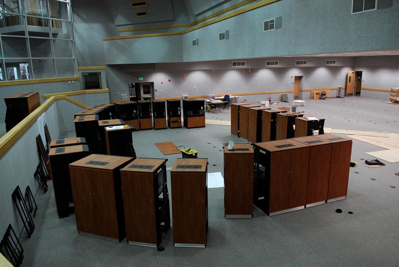 CAPE CANAVERAL, Fla. -- In Firing Room No. 1 in the Launch Control Center at NASA's Kennedy Space Center, cabinets are being erected to hold equipment that will support the future Ares rocket launches as part of the Constellation Program. Future astronauts will ride to orbit on Ares I, which uses a single five-segment solid rocket booster, a derivative of the space shuttle's solid rocket booster, for the first stage. Ares will be launched from Pad 39B, which is being reconfigured from supporting space shuttle launches. The Launch Control Center firing rooms face the launch pads. Photo credit: NASA/Kim Shiflett