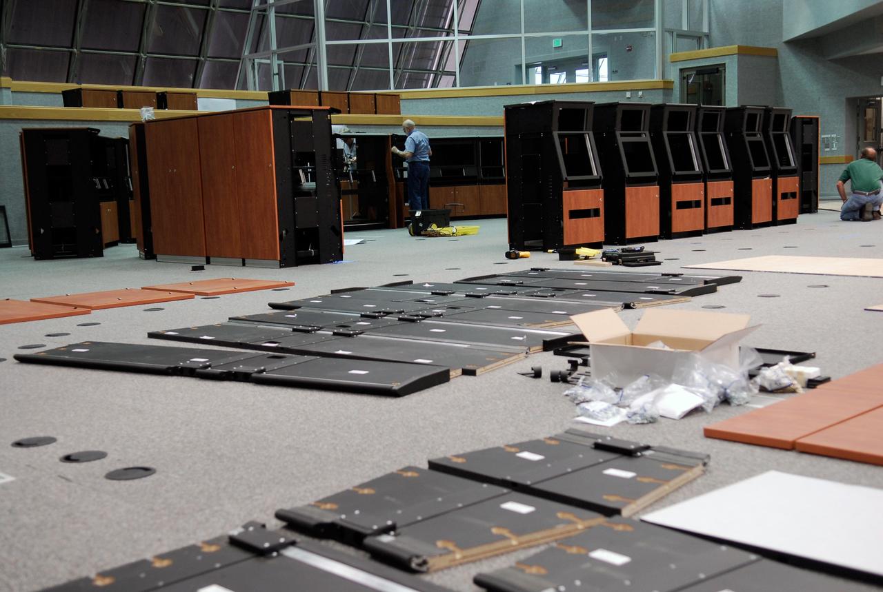CAPE CANAVERAL, Fla. -- In Firing Room No. 1 in the Launch Control Center at NASA's Kennedy Space Center, the number of new equipment cabinets increases as workers put the elements together. The firing room will support the future Ares rocket launches as part of the Constellation Program. Future astronauts will ride to orbit on Ares I, which uses a single five-segment solid rocket booster, a derivative of the space shuttle's solid rocket booster, for the first stage. Ares will be launched from Pad 39B, which is being reconfigured from supporting space shuttle launches. The Launch Control Center firing rooms face the launch pads. Photo credit: NASA/Kim Shiflett