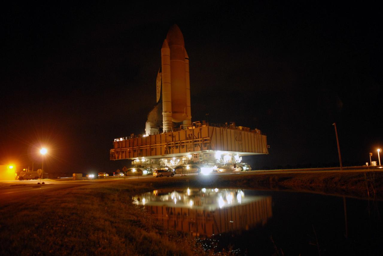 CAPE CANAVERAL, Fla. -- At NASA's Kennedy Space Center, a crawler transporter moves space shuttle Discovery, secured atop a mobile launch platform, along the crawlerway from the Vehicle Assembly Building to Launch Pad 39A to prepare for the STS-124 mission. The 3.4-mile journey from the Vehicle Assembly Building began at 11:47 p.m. on May 2. The shuttle arrived at the launch pad at 4:25 a.m. EDT May 3 and was secured, or hard down, by 6:06 a.m. On the 13-day mission, Discovery and its crew will deliver the Japan Aerospace Exploration Agency's Japanese Experiment Module – Pressurized Module and the Japanese Remote Manipulator System. Launch is targeted for May 31. Photo credit: NASA/Troy Cryder