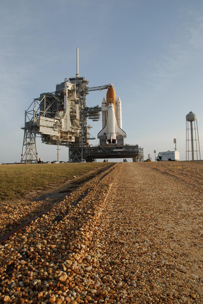 CAPE CANAVERAL, Fla. -- At NASA's Kennedy Space Center, tread marks from the shoes on the crawler-transporter are visible along the crawlerway leading up to the hardstand on Launch Pad 39A.  Space shuttle Discovery, secured atop the mobile launch platform below, has just arrived for final prelaunch processing for the STS-124 mission. The 3.4-mile journey from the Vehicle Assembly Building began at 11:47 p.m. on May 2.  The shuttle arrived at the launch pad at 4:25 a.m. EDT May 3 and was secured, or hard down, by 6:06 a.m.  On the 13-day mission, Discovery and its crew will deliver the Japan Aerospace Exploration Agency's Japanese Experiment Module – Pressurized Module and the Japanese Remote Manipulator System. Launch is targeted for May 31.  Photo credit: NASA/Troy Cryder