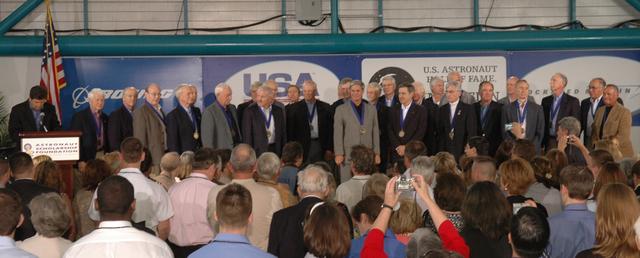 CAPE CANAVERAL, Fla. -- Members of the U.S. Astronaut Hall of Fame stand for an ovation following the induction of the newest members (at center): Loren Shriver; Bryan O'Connor, NASA's chief of Safety and Mission Assurance at NASA Headquarters in Washington; John Blaha; and Robert Cabana, center director of NASA's Stennis Space Center in Mississippi. The ceremony was held May 3 at NASA's Kennedy Space Center. Other former astronauts attending included Scott Carpenter, John Young, Bob Crippen, and Walt Cunningham. The U.S. Astronaut Hall of Fame is operated by Kennedy Space Center Visitor Complex on behalf of NASA. CNN correspondent John Zarrella hosted the event.