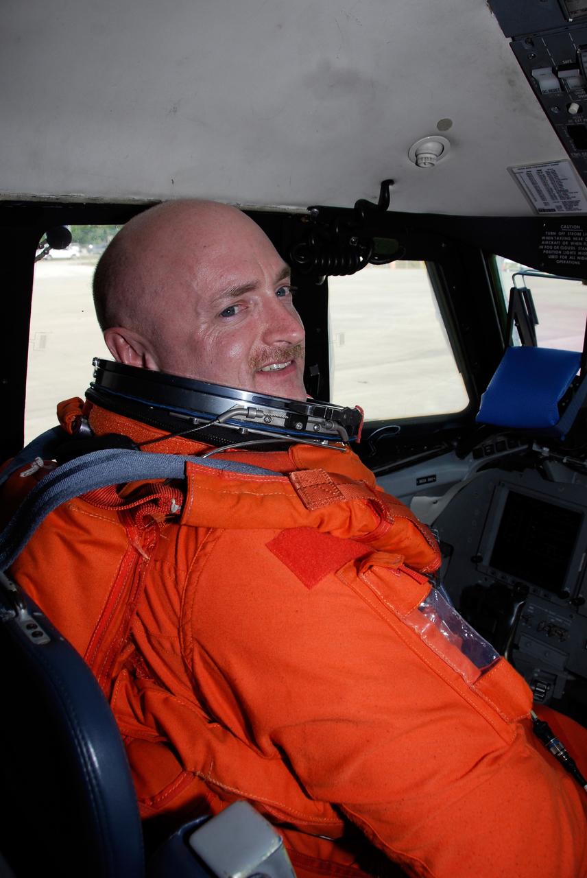 CAPE CANAVERAL, Fla. -- STS-124 Commander Mark Kelly sits in the cockpit of NASA's Shuttle Training Aircraft, or STA, preparing to practice space shuttle landings. The STA is a Grumman American Aviation-built Gulf Stream II jet that was modified to simulate an orbiter's cockpit, motion and visual cues, and handling qualities. In flight, the STA duplicates the orbiter's atmospheric descent trajectory from approximately 35,000 feet altitude to landing on a runway. Because the orbiter is unpowered during re-entry and landing, its high-speed glide must be perfectly executed the first time. The crew for space shuttle Discovery's STS-124 mission is at Kennedy for a full launch dress rehearsal, known as the terminal countdown demonstration test, or TCDT. Providing astronauts and ground crews with an opportunity to participate in various simulated countdown activities, TCDT includes equipment familiarization and emergency training. Discovery's launch is targeted for May 31. Photo credit: NASA/Kim Shiflett