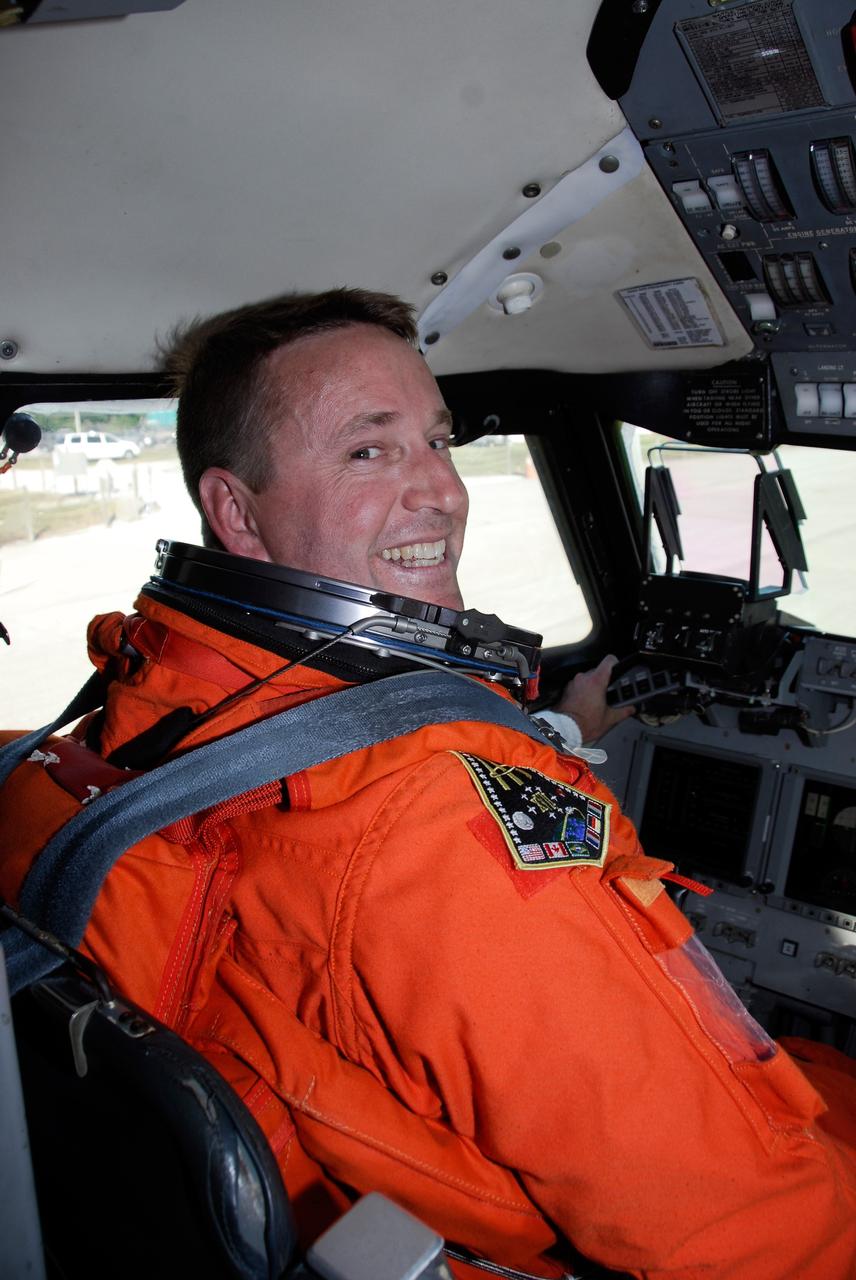 CAPE CANAVERAL, Fla. -- STS-124 Pilot Ken Ham takes his seat in the cockpit of NASA's Shuttle Training Aircraft, or STA, preparing to practice space shuttle landings. The STA is a Grumman American Aviation-built Gulf Stream II jet that was modified to simulate an orbiter's cockpit, motion and visual cues, and handling qualities. In flight, the STA duplicates the orbiter's atmospheric descent trajectory from approximately 35,000 feet altitude to landing on a runway. Because the orbiter is unpowered during re-entry and landing, its high-speed glide must be perfectly executed the first time. The crew for space shuttle Discovery's STS-124 mission is at Kennedy for a full launch dress rehearsal, known as the terminal countdown demonstration test, or TCDT. Providing astronauts and ground crews with an opportunity to participate in various simulated countdown activities, TCDT includes equipment familiarization and emergency training. Discovery's launch is targeted for May 31. Photo credit: NASA/Kim Shiflett