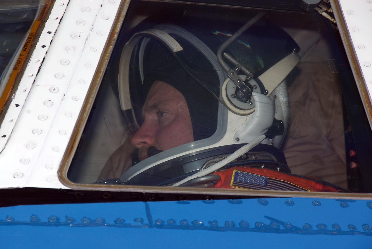 CAPE CANAVERAL, Fla. -- STS-124 Commander Mark Kelly is seen through the cockpit window of NASA's Shuttle Training Aircraft, or STA, before taxiing to the runway at the NASA Kennedy Space Center Shuttle Landing Facility to practice space shuttle landings. The STA is a Grumman American Aviation-built Gulf Stream II jet that was modified to simulate an orbiter's cockpit, motion and visual cues, and handling qualities. In flight, the STA duplicates the orbiter's atmospheric descent trajectory from approximately 35,000 feet altitude to landing on a runway. Because the orbiter is unpowered during re-entry and landing, its high-speed glide must be perfectly executed the first time. The crew for space shuttle Discovery's STS-124 mission is at Kennedy for a full launch dress rehearsal, known as the terminal countdown demonstration test, or TCDT. Providing astronauts and ground crews with an opportunity to participate in various simulated countdown activities, TCDT includes equipment familiarization and emergency training. Discovery's launch is targeted for May 31. Photo credit: NASA/Kim Shiflett