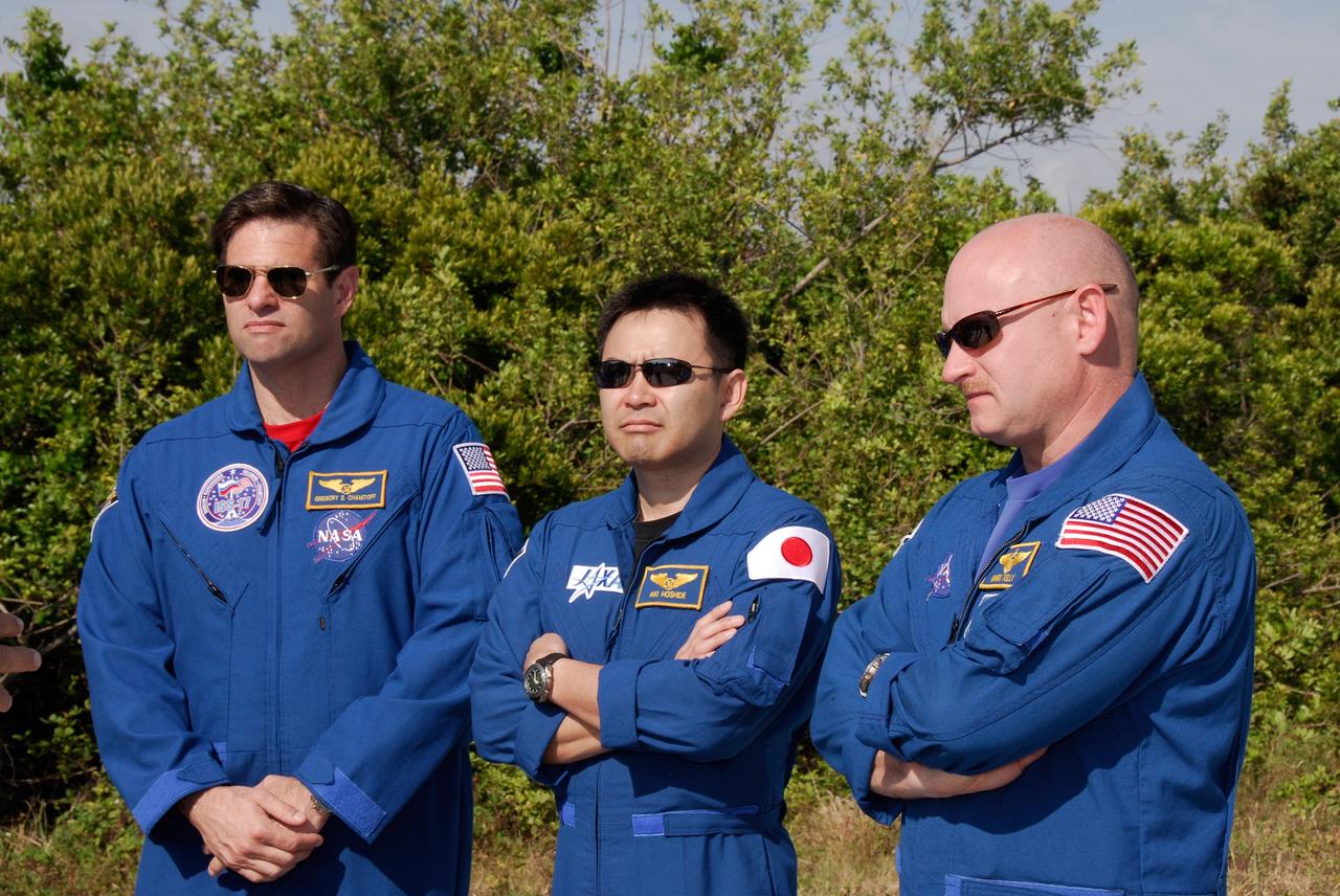 CAPE CANAVERAL, Fla. -- STS-124 Mission Specialists Greg Chamitoff (left) and Akihiko Hoshide (center) and Commander Mark Kelly take part in M113 training on Launch Pad 39A. They and other crew members are at NASA's Kennedy Space Center for a dress launch rehearsal called the terminal countdown demonstration test. TCDT provides astronauts and ground crews with an opportunity to participate in various simulated countdown activities, including equipment familiarization and emergency training. On the STS-124 mission, the crew will deliver and install the Japanese Experiment Module – Pressurized Module and Japanese Remote Manipulator System. Discovery's launch is targeted for May 31. Photo credit: NASA/Kim Shiflett