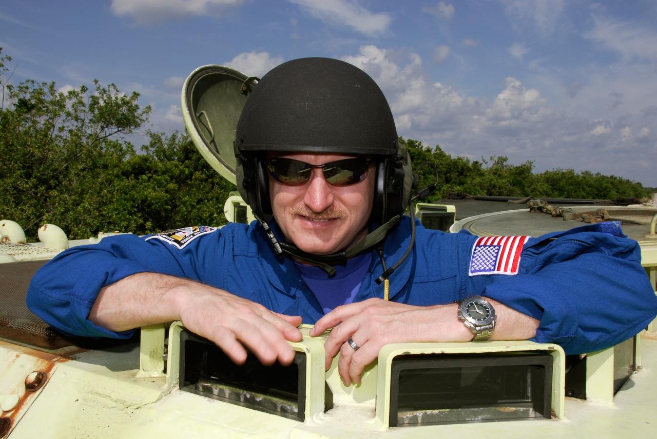 CAPE CANAVERAL, Fla. -- STS-124 Commander Mark Kelly is ready to practice driving the M113 armored personnel carrier as part of emergency training. He and other crew members are at NASA's Kennedy Space Center for a dress launch rehearsal called the terminal countdown demonstration test. TCDT provides astronauts and ground crews with an opportunity to participate in various simulated countdown activities, including equipment familiarization and emergency training. On the STS-124 mission, the crew will deliver and install the Japanese Experiment Module – Pressurized Module and Japanese Remote Manipulator System. Discovery's launch is targeted for May 31. Photo credit: NASA/Kim Shiflett