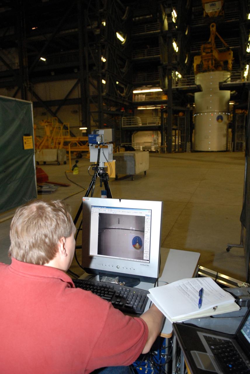CAPE CANAVERAL, Fla. -- Vibration and laser testing is being conducted on Ares I-X segments at NASA's Kennedy Space Center. LaRC Test Engineer Jim Gaspar programs coordinates of targets into the Laser Vibrometer. Photo credit: NASA/Dimitri Gerondidakis