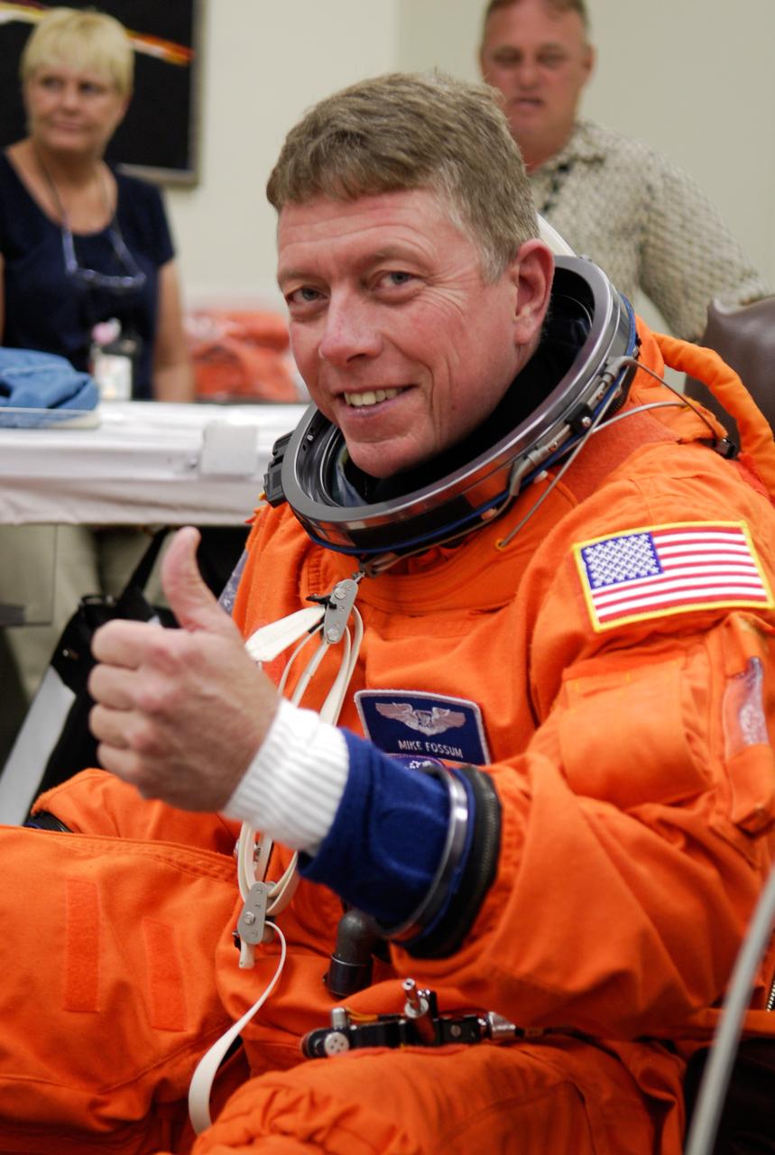 CAPE CANAVERAL, Fla. -- In the Operations and Checkout Building at NASA's Kennedy Space Center, STS-124 Mission Specialist Mike Fossum is dressed in his launch-and-entry suit and ready to start the simulated launch countdown. The simulation is the culmination of the launch dress rehearsal called the terminal countdown demonstration test. TCDT provides astronauts and ground crews with an opportunity to participate in various simulated countdown activities, including equipment familiarization and emergency training. On the STS-124 mission, the crew will deliver and install the Japanese Experiment Module – Pressurized Module and Japanese Remote Manipulator System. Discovery's launch is targeted for May 31. Photo credit: NASA/Kim Shiflett