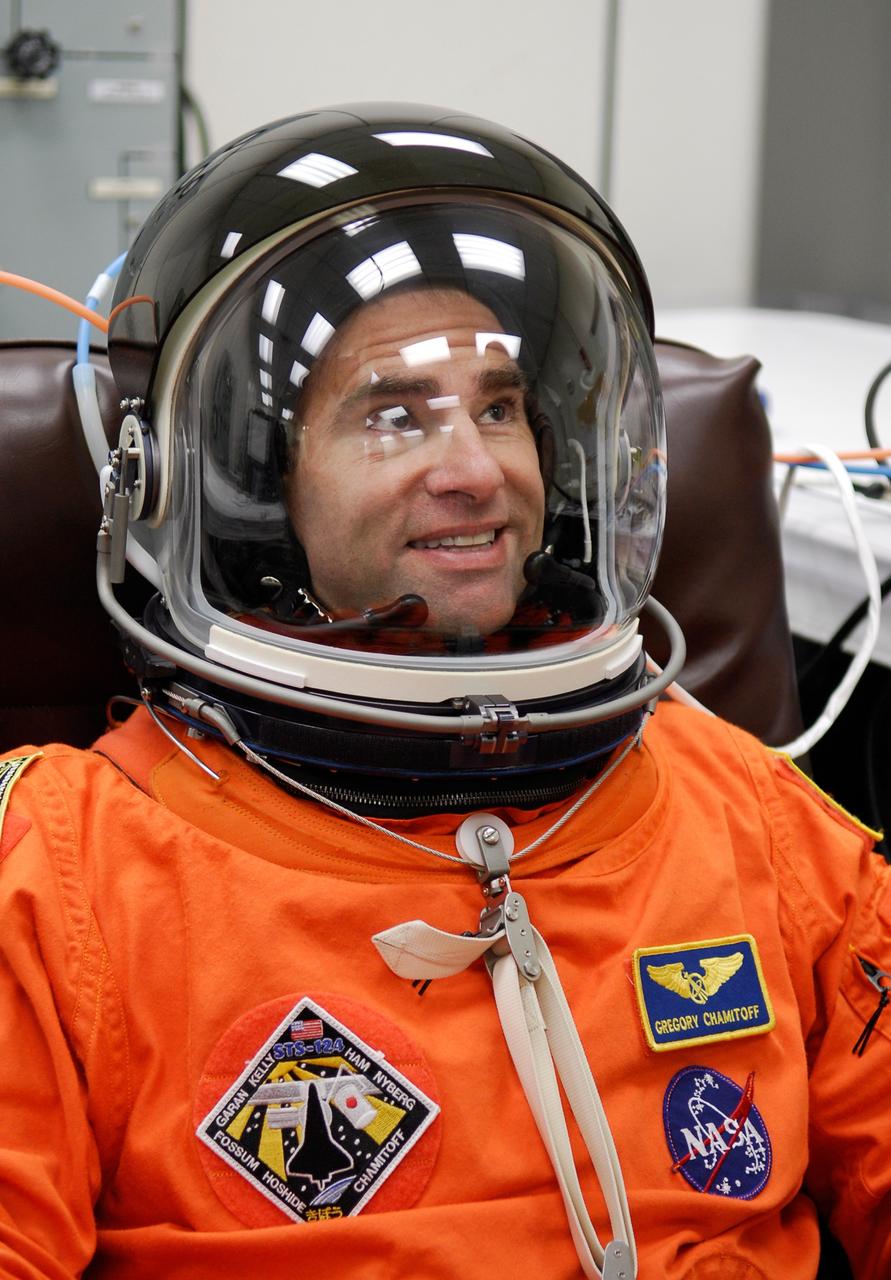 CAPE CANAVERAL, Fla. -- In the Operations and Checkout Building at NASA's Kennedy Space Center, STS-124 Mission Specialist Greg Chamitoff is dressed and ready for the simulated launch countdown. The simulation is the culmination of the launch dress rehearsal called the terminal countdown demonstration test. TCDT provides astronauts and ground crews with an opportunity to participate in various simulated countdown activities, including equipment familiarization and emergency training. On the STS-124 mission, the crew will deliver and install the Japanese Experiment Module – Pressurized Module and Japanese Remote Manipulator System. Discovery's launch is targeted for May 31. Photo credit: NASA/Kim Shiflett