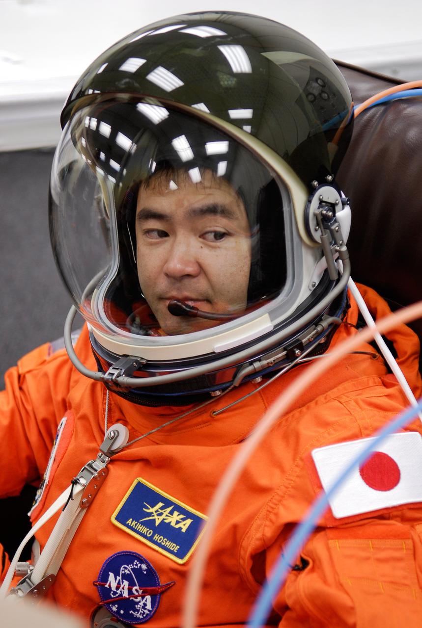 CAPE CANAVERAL, Fla. -- In the Operations and Checkout Building at NASA's Kennedy Space Center, STS-124 Mission Specialist Akihiko Hoshide is dressed and ready for the simulated launch countdown. Hoshide represents the Japan Aerospace Exploration Agency, or JAXA. The simulation is the culmination of the launch dress rehearsal called the terminal countdown demonstration test. TCDT provides astronauts and ground crews with an opportunity to participate in various simulated countdown activities, including equipment familiarization and emergency training. On the STS-124 mission, the crew will deliver and install the Japanese Experiment Module – Pressurized Module and Japanese Remote Manipulator System. Discovery's launch is targeted for May 31. Photo credit: NASA/Kim Shiflett