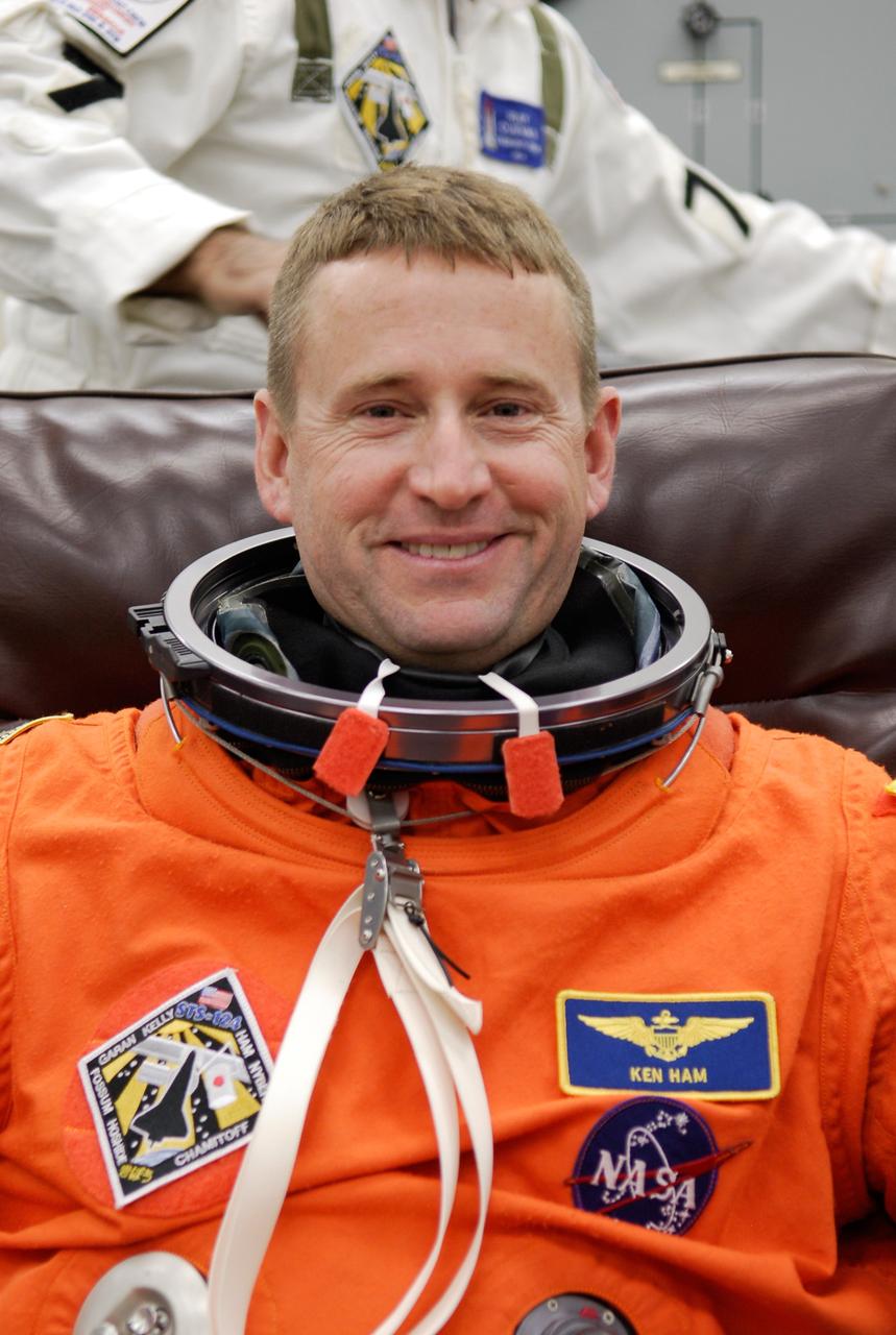 CAPE CANAVERAL, Fla. -- In the Operations and Checkout Building at NASA's Kennedy Space Center, STS-124 Pilot Ken Ham dons his launch-and-entry suit needed for the simulated launch countdown. The simulation is the culmination of the launch dress rehearsal called the terminal countdown demonstration test. TCDT provides astronauts and ground crews with an opportunity to participate in various simulated countdown activities, including equipment familiarization and emergency training. On the STS-124 mission, the crew will deliver and install the Japanese Experiment Module – Pressurized Module and Japanese Remote Manipulator System. Discovery's launch is targeted for May 31. Photo credit: NASA/Kim Shiflett