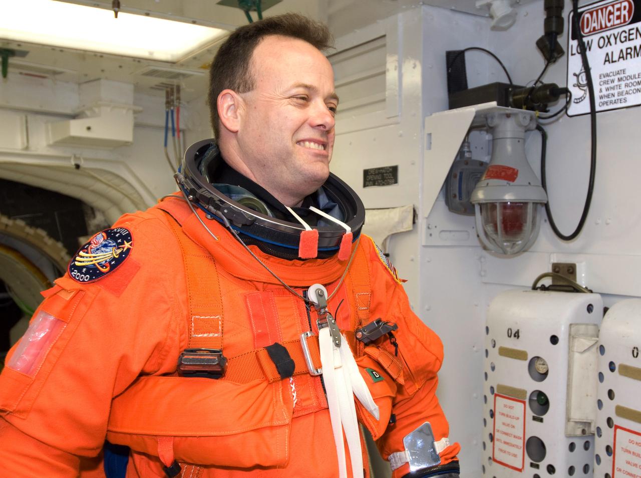 CAPE CANAVERAL, Fla. -- In the White Room on Launch Pad 39A at NASA's Kennedy Space Center, STS-124 Mission Specialist Ron Garan is ready for the simulated launch countdown, part of the launch dress rehearsal known as the terminal countdown demonstration test. The simulation serves as a practice exercise in which both the launch team and flight crew rehearse launch day time lines and procedures. The test culminates in a simulated ignition and automated shutdown of the orbiter's main engines.  On the STS-124 mission, the crew will deliver and install the Japanese Experiment Module – Pressurized Module and Japanese Remote Manipulator System.  Discovery's launch is targeted for May 31.  Photo credit: NASA/Amanda Diller