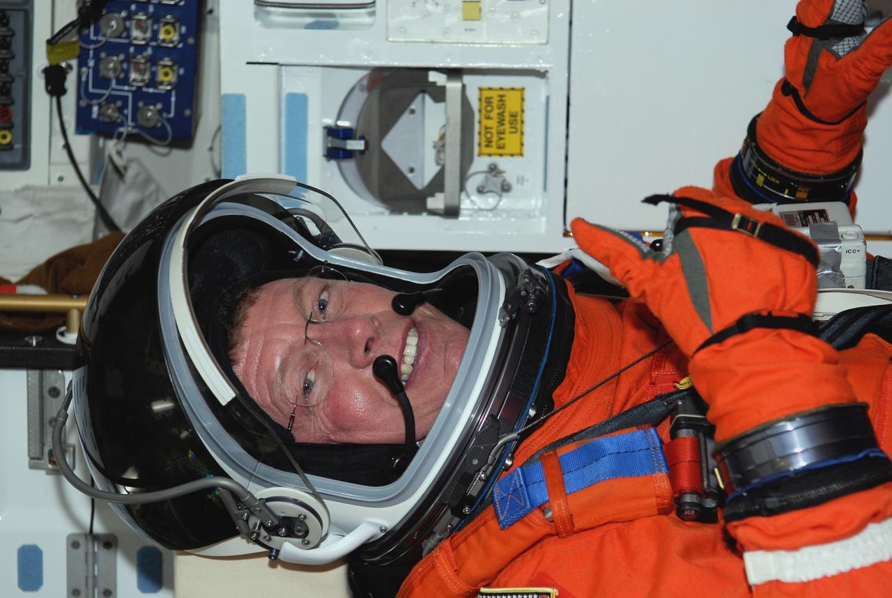 CAPE CANAVERAL, Fla. -- On Launch Pad 39A at NASA's Kennedy Space Center, STS-124 Mission Specialist Mike Fossum sits in his seat aboard space shuttle Discovery following the simulated launch countdown, part of the launch dress rehearsal known as the terminal countdown demonstration test. TCDT provides astronauts and ground crews with an opportunity to participate in various simulated countdown activities, including a simulated launch countdown, equipment familiarization and emergency egress training. On the STS-124 mission, the crew will deliver and install the Japanese Experiment Module – Pressurized Module and Japanese Remote Manipulator System. Discovery's launch is targeted for May 31. Photo credit: NASA/Kim Shiflett