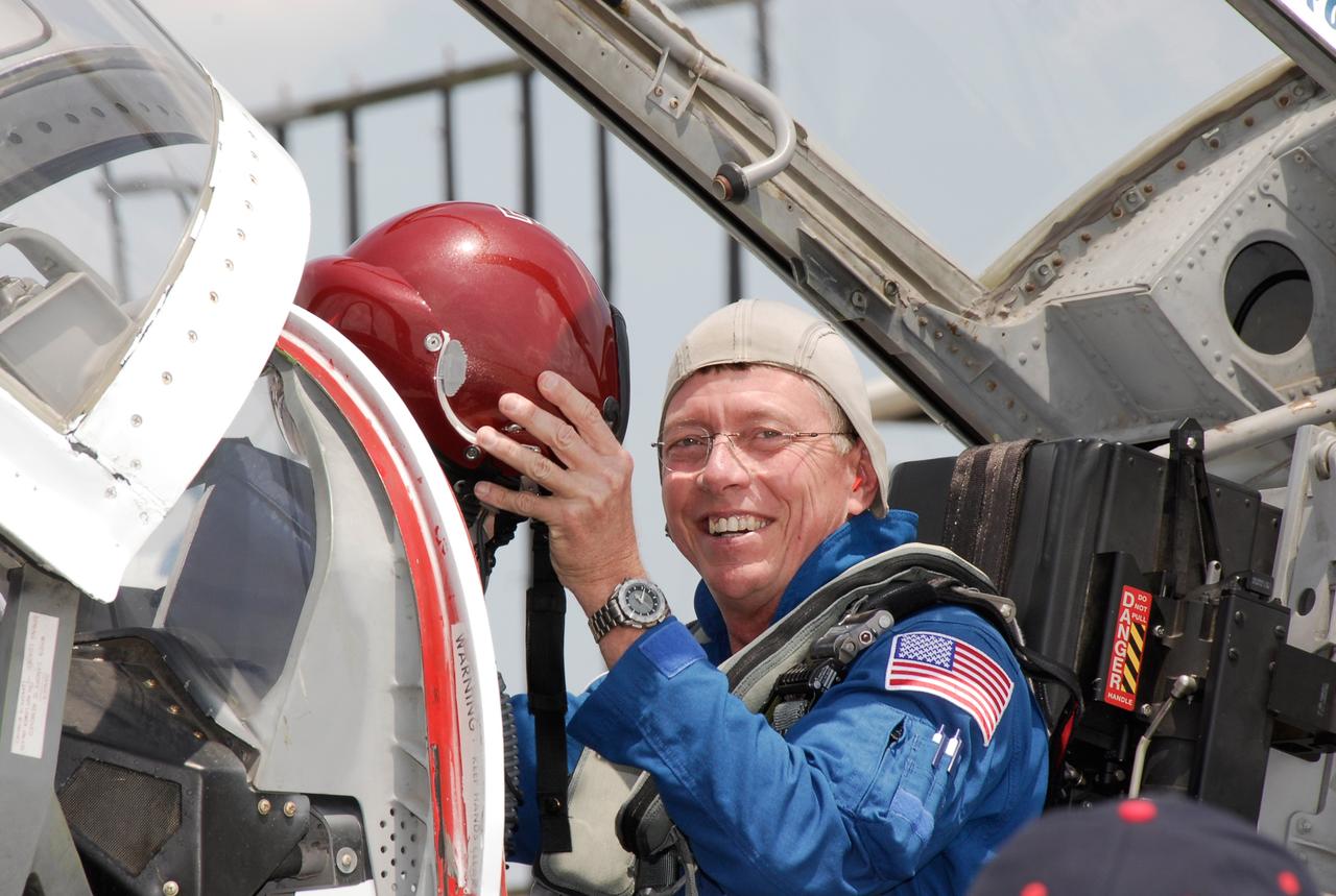 CAPE CANAVERAL, Fla. -- The STS-124 crew departs NASA's Kennedy Space Center after a successful launch dress rehearsal called the terminal countdown demonstration test. Seated in the T-38 training jet, Mission Specialist Mike Fossum is ready to put on his helmet for the flight back to Houston. The crew is expected to return in late May for the May 31 launch of space shuttle Discovery. On the STS-124 mission, the crew will deliver and install the Japanese Experiment Module – Pressurized Module and Japanese Remote Manipulator System. Photo credit: NASA/Kim Shiflett
