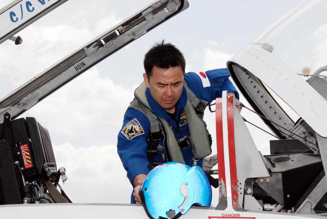 CAPE CANAVERAL, Fla. -- The crew for the STS-124 mission departs NASA's Kennedy Space Center after a successful launch dress rehearsal called the terminal countdown demonstration test. Mission Specialist Akihiko Hoshide climbs into the T-38 training jet for he flight back to Houston. The crew is expected to return in late May for the May 31 launch of space shuttle Discovery. On the STS-124 mission, the crew will deliver and install the Japanese Experiment Module – Pressurized Module and Japanese Remote Manipulator System. Photo credit: NASA/Kim Shiflett