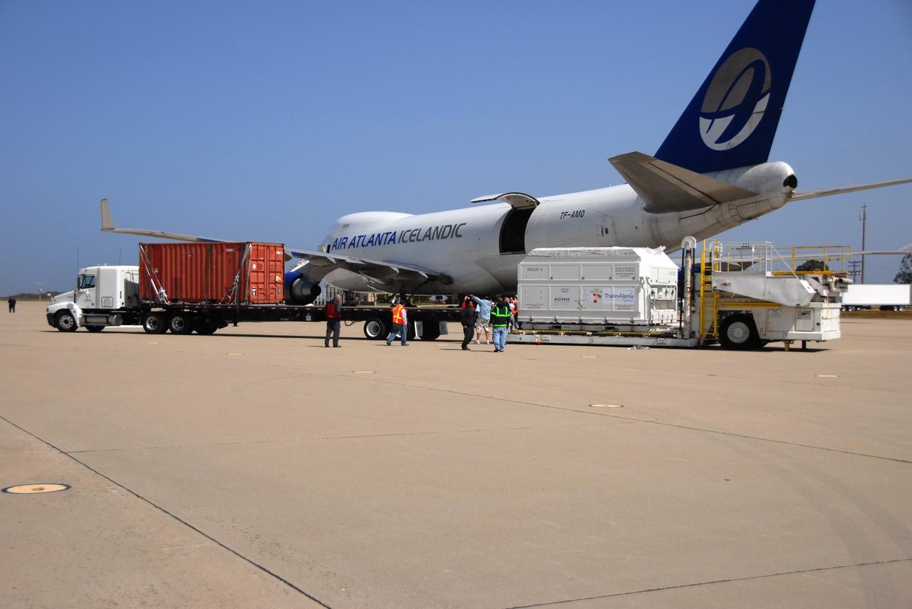 VANDENBERG AIR FORCE BASE, Calif. --  Workers prepare to move the shipping container holding the OSTM/Jason-2 satellite onto a flatbed truck at Vandenberg Air Force Base.  The satellite will be transported to the Astrotech processing facility. The OSTM, or Ocean Topography Mission, on the Jason-2 satellite is a follow-on to Jason-1. It will take oceanographic studies of sea surface height into an operational mode for continued climate forecasting research and science and industrial applications.  This satellite altimetry data will help determine ocean circulation, climate change and sea-level rise. OSTM is a joint effort by the National Oceanic and Atmospheric Administration, NASA, France’s Centre National d’Etudes Spatiales and the European Meteorological Satellite Organisation. OSTM/Jason-2 will be launched aboard a United Launch Alliance Delta II 7320 from Vandenberg on June 15.  Photo credit: NASA/Dan Liberotti