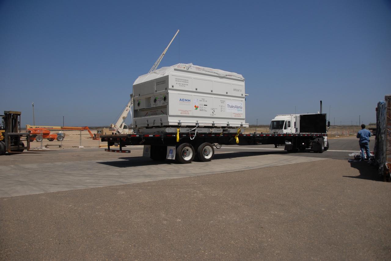 VANDENBERG AIR FORCE BASE, Calif. --  At Vandenberg Air Force Base, the truck carrying the OSTM/Jason-2 satellite arrives at the Astrotech processing facility.  The OSTM, or Ocean Topography Mission, on the Jason-2 satellite is a follow-on to Jason-1. It will take oceanographic studies of sea surface height into an operational mode for continued climate forecasting research and science and industrial applications.  This satellite altimetry data will help determine ocean circulation, climate change and sea-level rise. OSTM is a joint effort by the National Oceanic and Atmospheric Administration, NASA, France’s Centre National d’Etudes Spatiales and the European Meteorological Satellite Organisation. OSTM/Jason-2 will be launched aboard a United Launch Alliance Delta II 7320 from Vandenberg on June 15.  Photo credit: NASA/Dan Liberotti