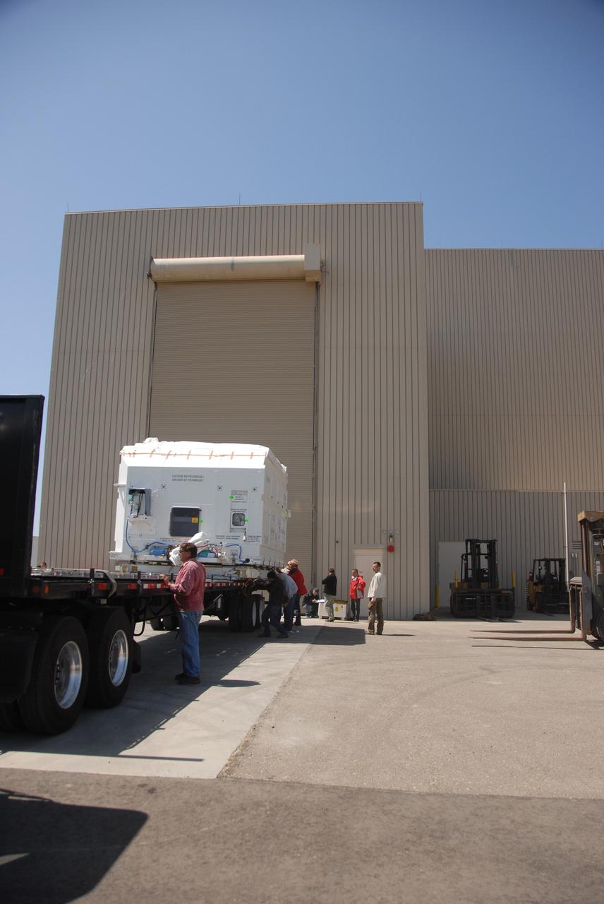 VANDENBERG AIR FORCE BASE, Calif. --  At Vandenberg Air Force Base, the truck carrying the OSTM/Jason-2 satellite arrives at the Astrotech processing facility.  The OSTM, or Ocean Topography Mission, on the Jason-2 satellite is a follow-on to Jason-1. It will take oceanographic studies of sea surface height into an operational mode for continued climate forecasting research and science and industrial applications.  This satellite altimetry data will help determine ocean circulation, climate change and sea-level rise. OSTM is a joint effort by the National Oceanic and Atmospheric Administration, NASA, France’s Centre National d’Etudes Spatiales and the European Meteorological Satellite Organisation. OSTM/Jason-2 will be launched aboard a United Launch Alliance Delta II 7320 from Vandenberg on June 15.  Photo credit: NASA/Dan Liberotti
