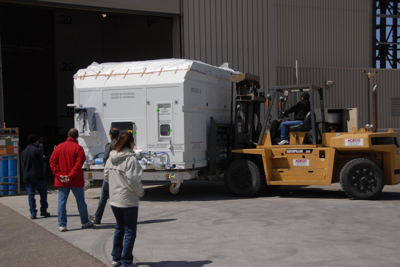 VANDENBERG AIR FORCE BASE, Calif. -- At Vandenberg Air Force Base, the OSTM/Jason-2 satellite shipping container is being moved inside the Astrotech processing facility. The OSTM, or Ocean Topography Mission, on the Jason-2 satellite is a follow-on to Jason-1. It will take oceanographic studies of sea surface height into an operational mode for continued climate forecasting research and science and industrial applications.  This satellite altimetry data will help determine ocean circulation, climate change and sea-level rise. OSTM is a joint effort by the National Oceanic and Atmospheric Administration, NASA, France’s Centre National d’Etudes Spatiales and the European Meteorological Satellite Organisation. OSTM/Jason-2 will be launched aboard a United Launch Alliance Delta II 7320 from Vandenberg on June 15.  Photo credit: NASA/Dan Liberotti