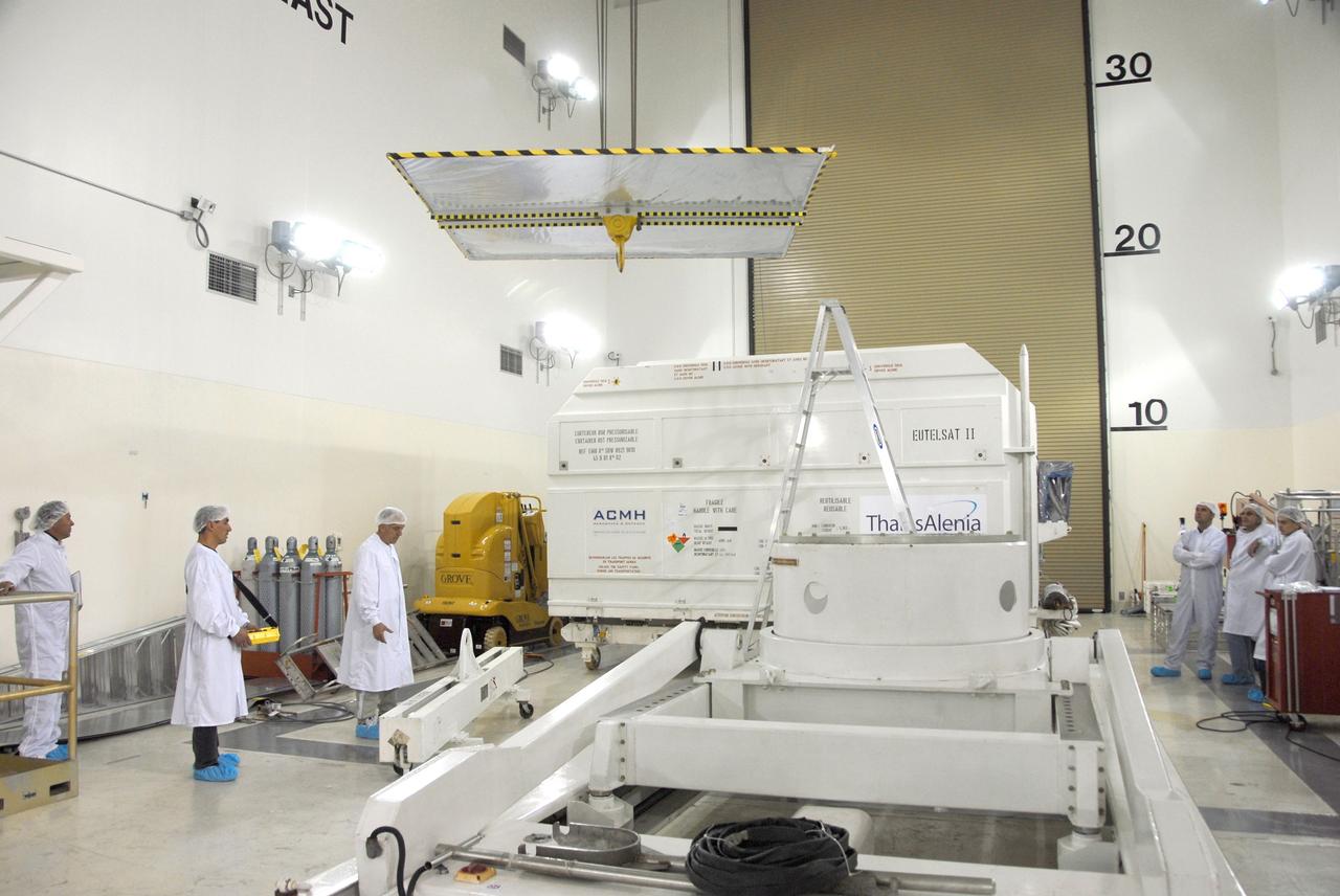 VANDENBERG AIR FORCE BASE, Calif. --  Inside the Astrotech processing facility at Vandenberg Air Force Base, an overhead crane is moved over the OSTM/Jason-2 spacecraft to lift off the shipping container.  The OSTM, or Ocean Topography Mission, on the Jason-2 satellite is a follow-on to Jason-1. It will take oceanographic studies of sea surface height into an operational mode for continued climate forecasting research and science and industrial applications.  This satellite altimetry data will help determine ocean circulation, climate change and sea-level rise. OSTM is a joint effort by the National Oceanic and Atmospheric Administration, NASA, France’s Centre National d’Etudes Spatiales and the European Meteorological Satellite Organisation. OSTM/Jason-2 will be launched aboard a United Launch Alliance Delta II 7320 from Vandenberg on June 15.  Photo credit: NASA/Mark Mackley