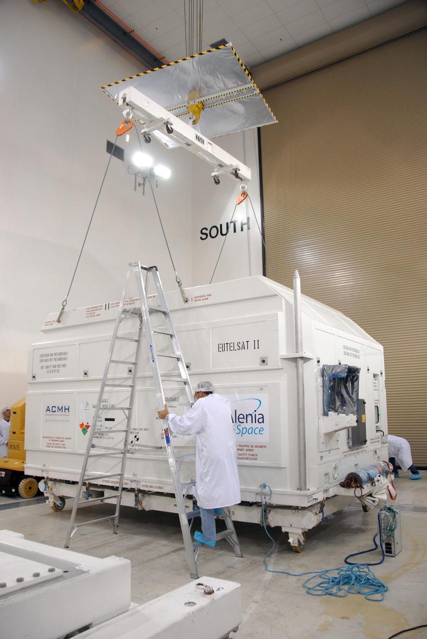 VANDENBERG AIR FORCE BASE, Calif. -- Inside the Astrotech processing facility at Vandenberg Air Force Base, an overhead crane is attached to the OSTM/Jason-2 spacecraft shipping container to remove it.  The OSTM, or Ocean Topography Mission, on the Jason-2 satellite is a follow-on to Jason-1. It will take oceanographic studies of sea surface height into an operational mode for continued climate forecasting research and science and industrial applications.  This satellite altimetry data will help determine ocean circulation, climate change and sea-level rise. OSTM is a joint effort by the National Oceanic and Atmospheric Administration, NASA, France’s Centre National d’Etudes Spatiales and the European Meteorological Satellite Organisation. OSTM/Jason-2 will be launched aboard a United Launch Alliance Delta II 7320 from Vandenberg on June 15.  Photo credit: NASA/Mark Mackley