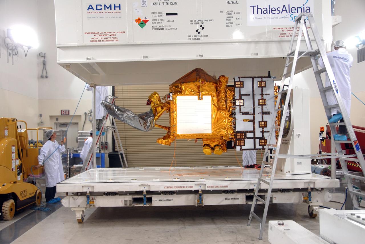 VANDENBERG AIR FORCE BASE, Calif. -- Inside the Astrotech processing facility at Vandenberg Air Force Base, the shipping container is removed from the OSTM/Jason-2 spacecraft.  The OSTM, or Ocean Topography Mission, on the Jason-2 satellite is a follow-on to Jason-1. It will take oceanographic studies of sea surface height into an operational mode for continued climate forecasting research and science and industrial applications.  This satellite altimetry data will help determine ocean circulation, climate change and sea-level rise. OSTM is a joint effort by the National Oceanic and Atmospheric Administration, NASA, France’s Centre National d’Etudes Spatiales and the European Meteorological Satellite Organisation. OSTM/Jason-2 will be launched aboard a United Launch Alliance Delta II 7320 from Vandenberg on June 15.  Photo credit: NASA/Mark Mackley