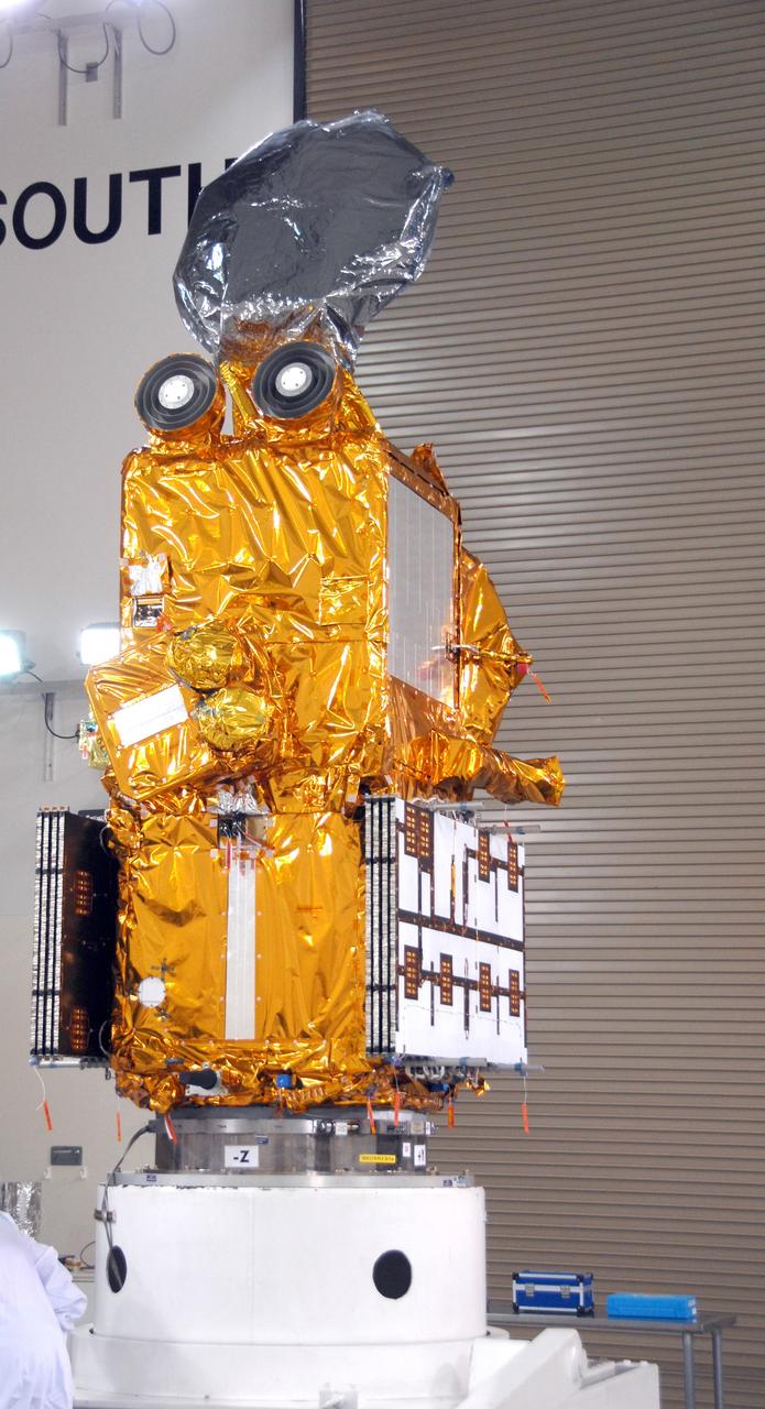 VANDENBERG AIR FORCE BASE, Calif. --  Inside the Astrotech processing facility at Vandenberg Air Force Base, the OSTM/Jason-2 spacecraft is viewed from another angle after being lifted to a vertical position on the tilt dolly.  The OSTM, or Ocean Topography Mission, on the Jason-2 satellite is a follow-on to Jason-1. It will take oceanographic studies of sea surface height into an operational mode for continued climate forecasting research and science and industrial applications.  This satellite altimetry data will help determine ocean circulation, climate change and sea-level rise. OSTM is a joint effort by the National Oceanic and Atmospheric Administration, NASA, France’s Centre National d’Etudes Spatiales and the European Meteorological Satellite Organisation. OSTM/Jason-2 will be launched aboard a United Launch Alliance Delta II 7320 from Vandenberg on June 15.  Photo credit: NASA/Mark Mackley