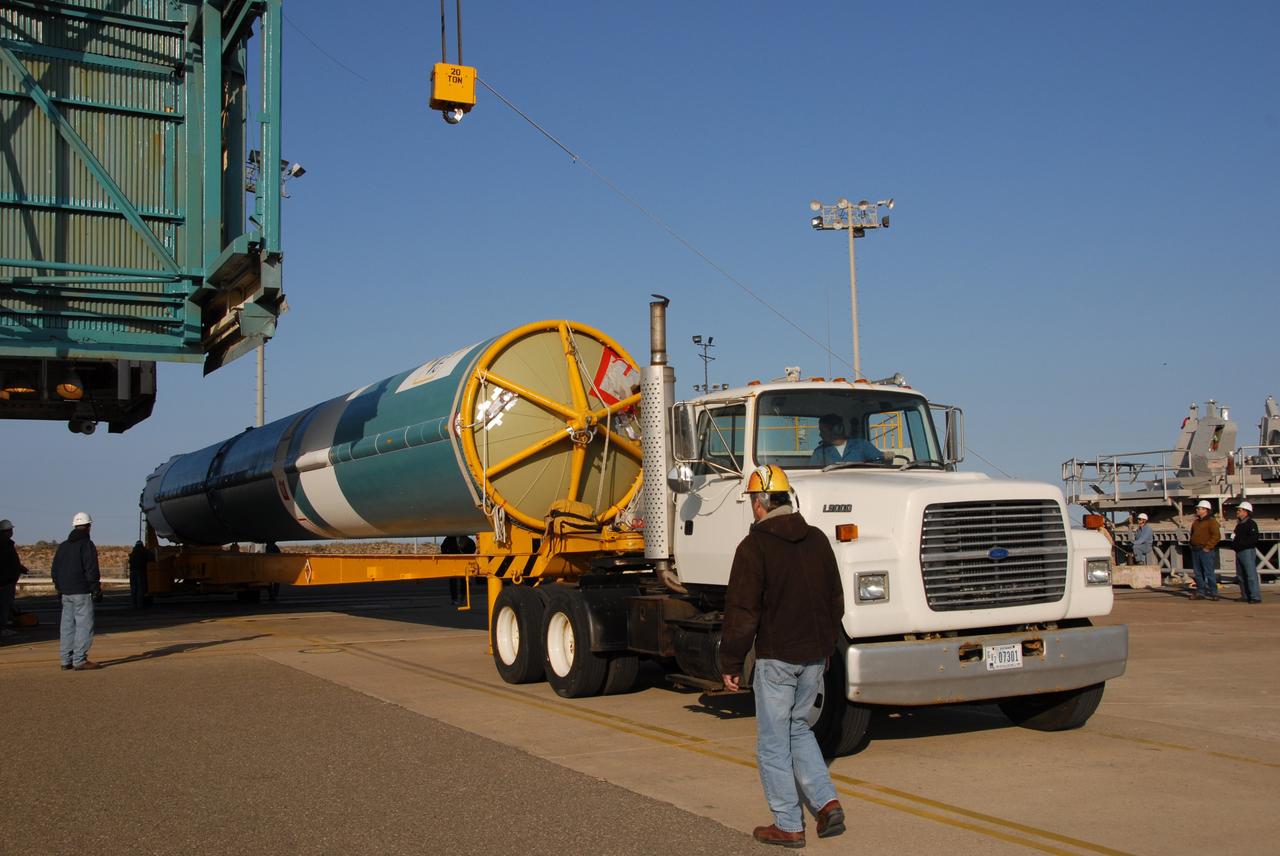 VANDENBERG AIR FORCE BASE, Calif. --  At Vandenberg Air Force Base in California, the Delta II first stage for the OSTM/Jason-2 spacecraft arrives at the base of the mobile service tower on Space Launch Complex 2.  The first stage will be raised to vertical and lifted into the tower.  The OSTM, or Ocean Topography Mission, on the Jason-2 satellite is a follow-on to Jason-1. It will take oceanographic studies of sea surface height into an operational mode for continued climate forecasting research and science and industrial applications.  This satellite altimetry data will help determine ocean circulation, climate change and sea-level rise. OSTM is a joint effort by the National Oceanic and Atmospheric Administration, NASA, France’s Centre National d’Etudes Spatiales and the European Meteorological Satellite Organisation. OSTM/Jason-2 will be launched aboard a United Launch Alliance Delta II 7320 from Vandenberg on June 15.  Photo credit: NASA/Dan Liberotti