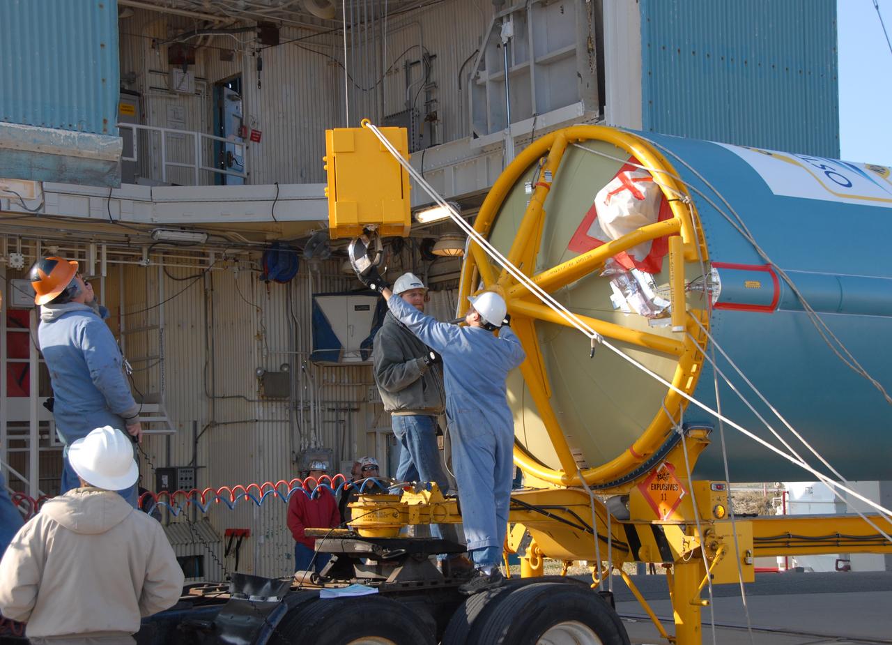 VANDENBERG AIR FORCE BASE, Calif. --  At Vandenberg Air Force Base in California, workers prepare the equipment on Space Launch Complex 2 to raise the Delta II first stage of the OSTM/Jason-2 spacecraft.  Once it is vertical, the first stage will be transferred into the mobile service tower.  The OSTM, or Ocean Topography Mission, on the Jason-2 satellite is a follow-on to Jason-1. It will take oceanographic studies of sea surface height into an operational mode for continued climate forecasting research and science and industrial applications.  This satellite altimetry data will help determine ocean circulation, climate change and sea-level rise. OSTM is a joint effort by the National Oceanic and Atmospheric Administration, NASA, France’s Centre National d’Etudes Spatiales and the European Meteorological Satellite Organisation. OSTM/Jason-2 will be launched aboard a United Launch Alliance Delta II 7320 from Vandenberg on June 15.  Photo credit: NASA/Dan Liberotti